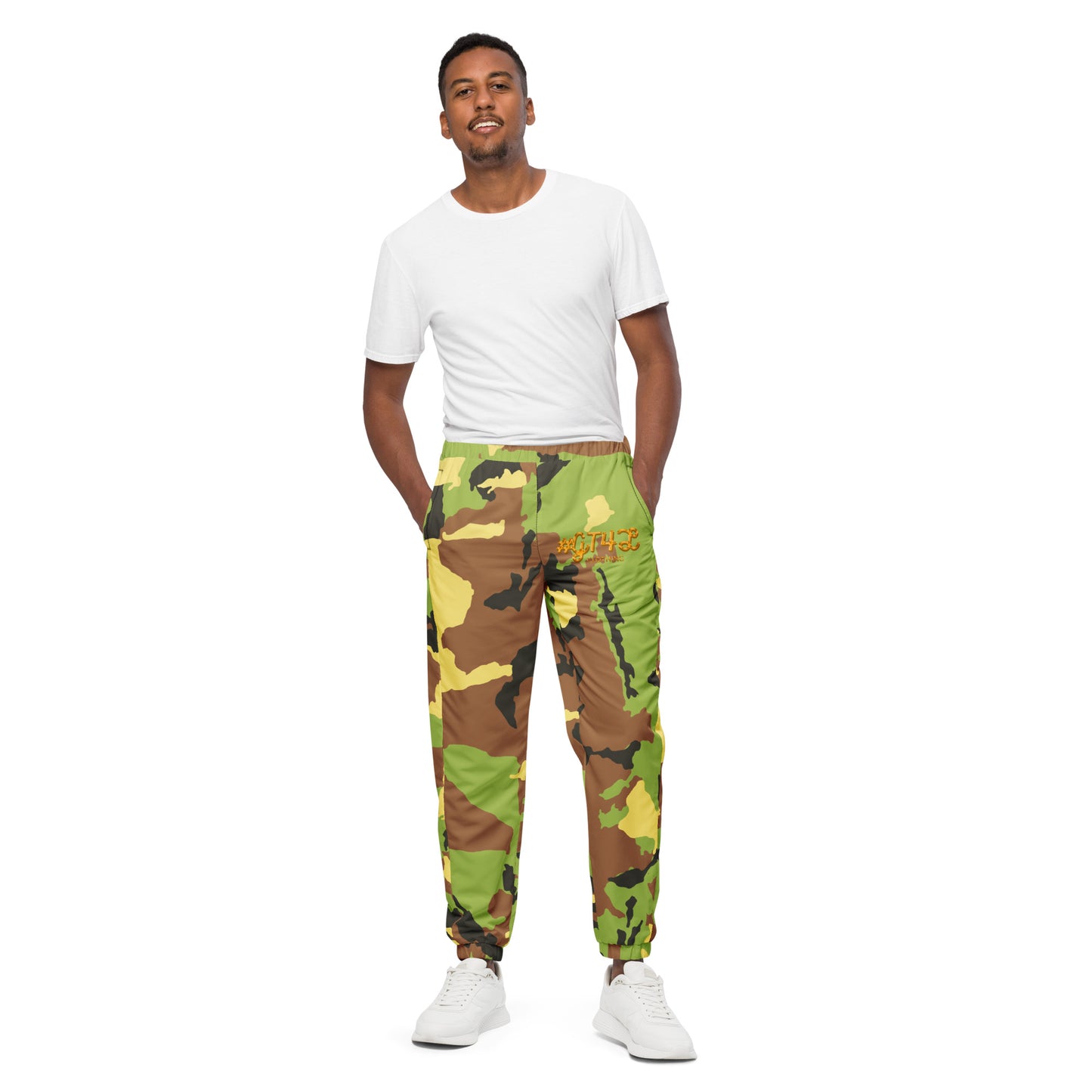 Man wearing a white t-shirt and camouflage pants on a white background