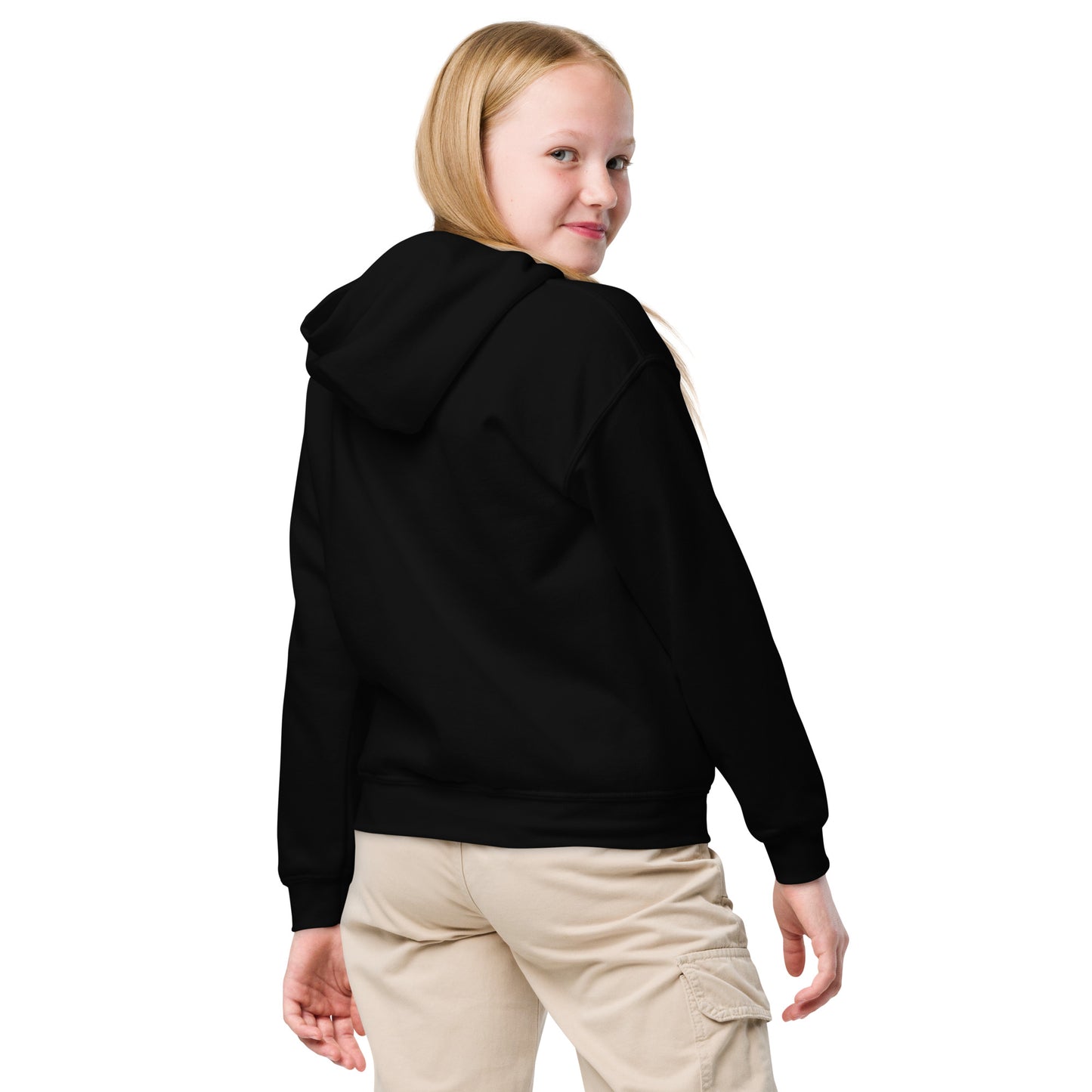 Person wearing a black hoodie and beige pants on a white background