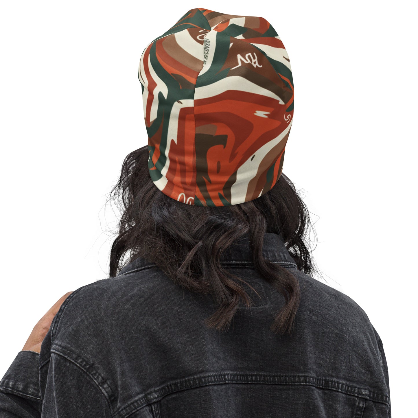 Person wearing a colorful bandana with abstract patterns on a white background