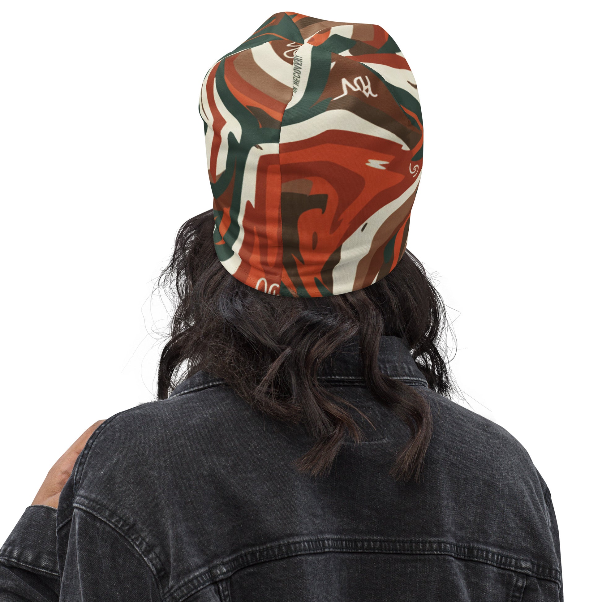 Person wearing a colorful bandana with abstract patterns on a white background