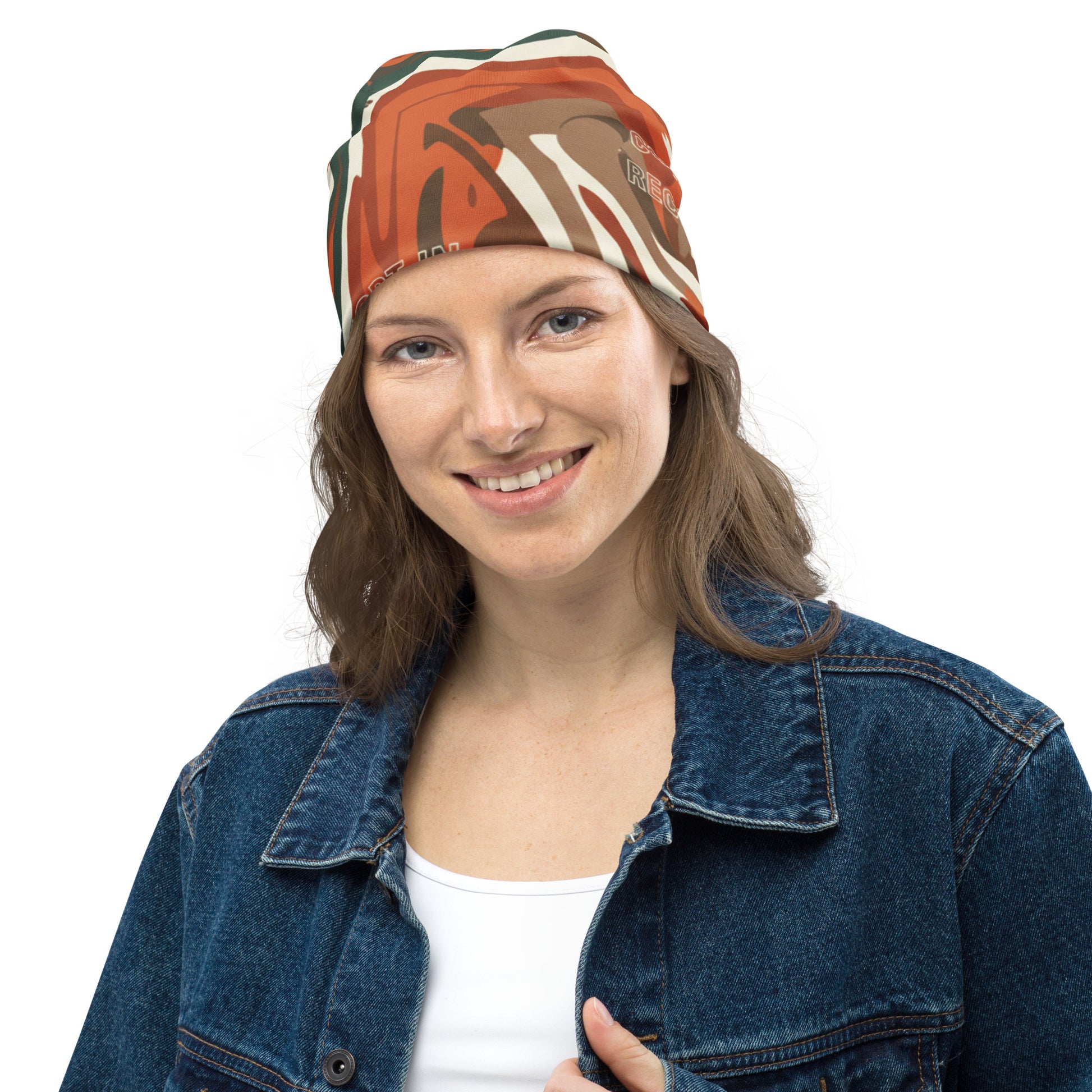 Woman wearing a colorful headband and denim jacket on a white background