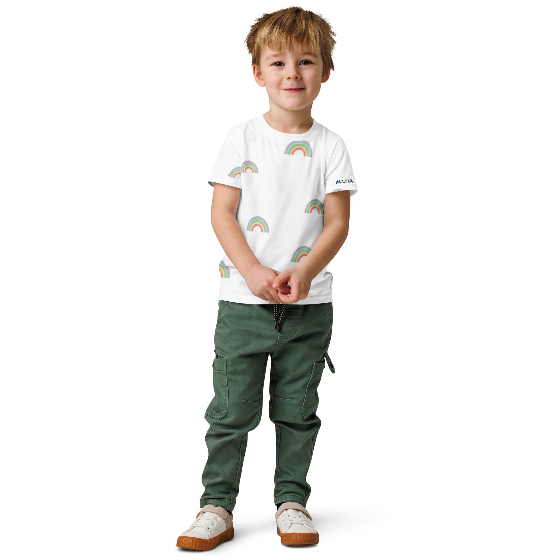 Child wearing a white t-shirt with colorful patterns and green pants on a white background