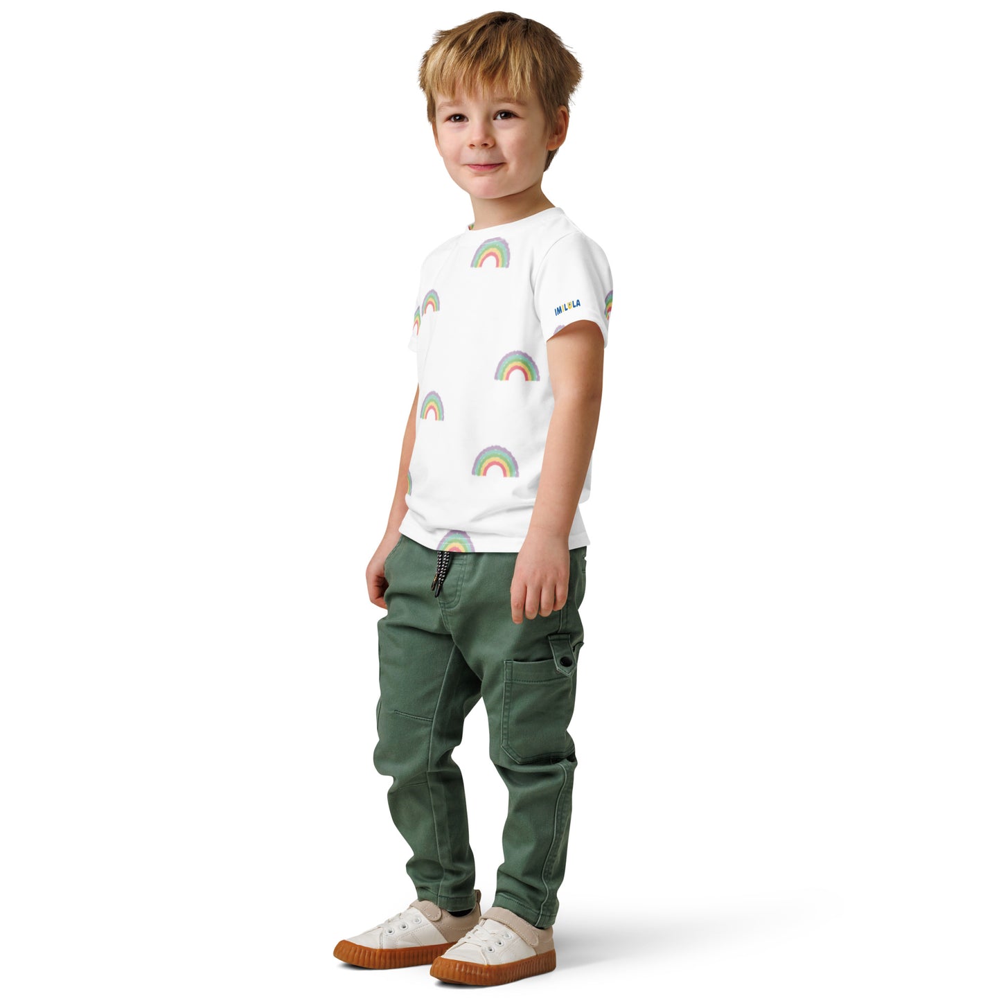 Child wearing a white checkered shirt and green pants on a white background
