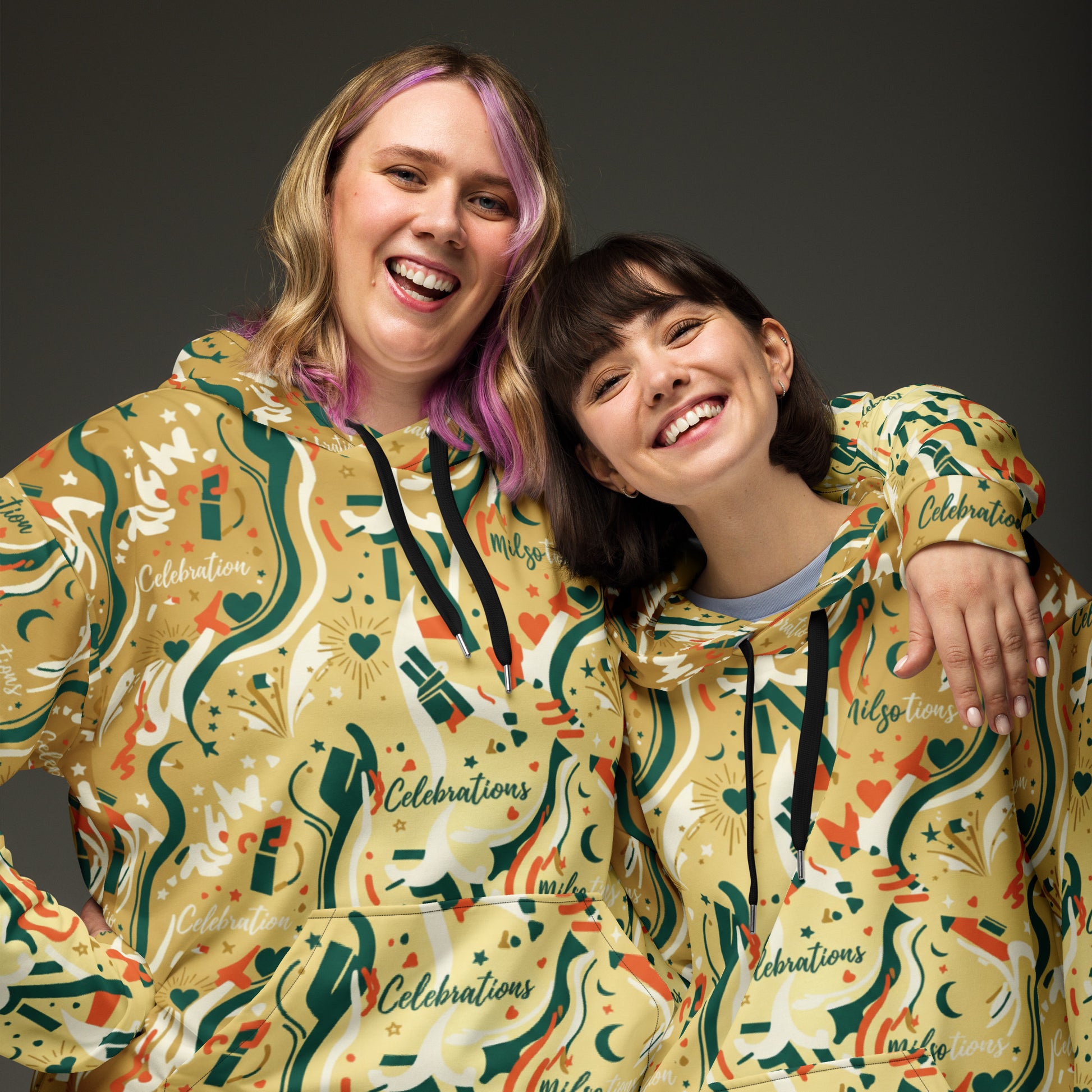 Two people wearing colorful hoodies with 'Celebrations' text on a dark background