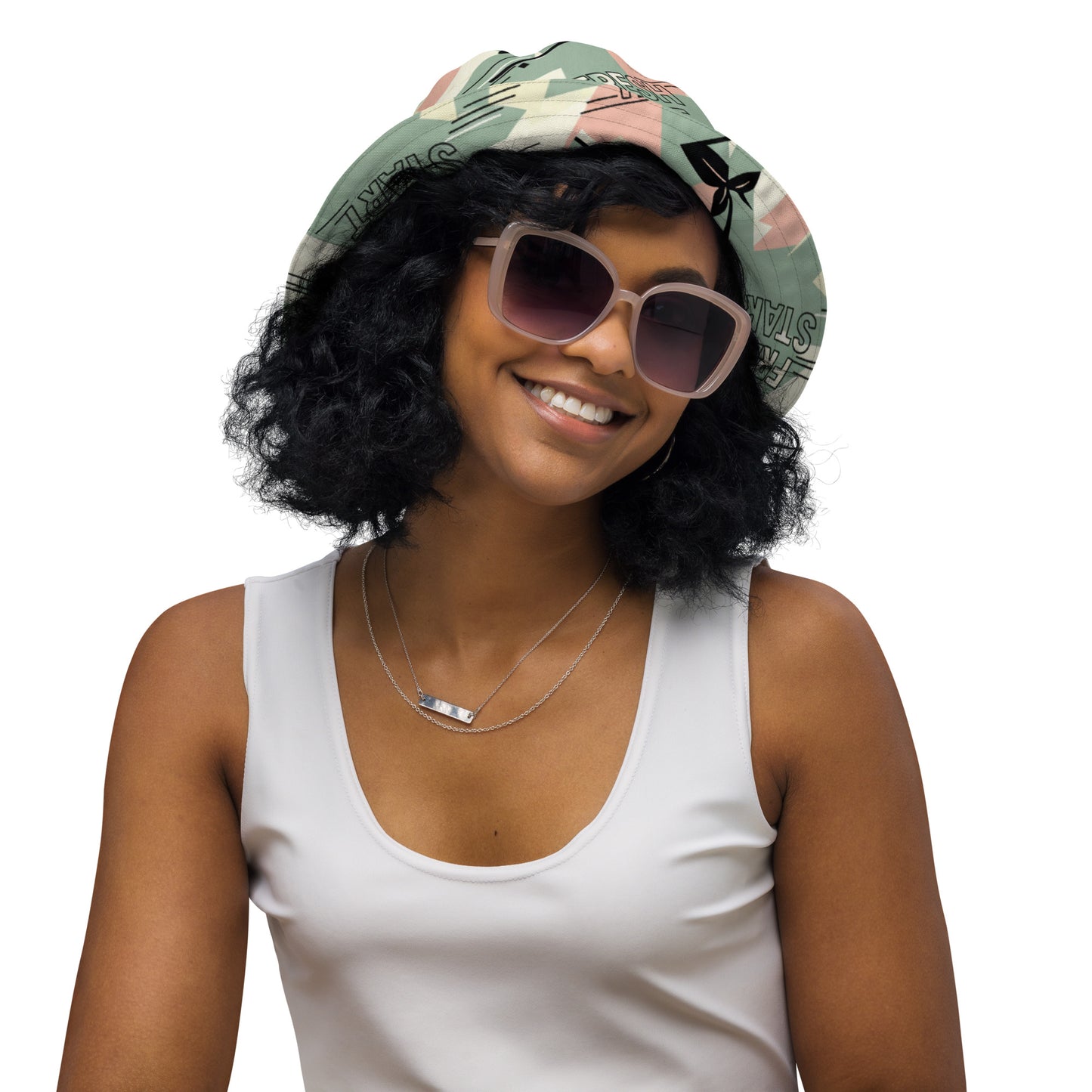 Woman wearing a colorful headscarf and sunglasses on a white background