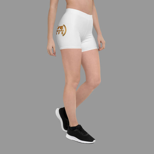 White athletic shorts with a logo worn by a person on a white background