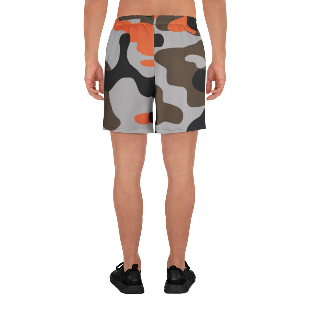 Camouflage-patterned shorts worn by a person on a white background