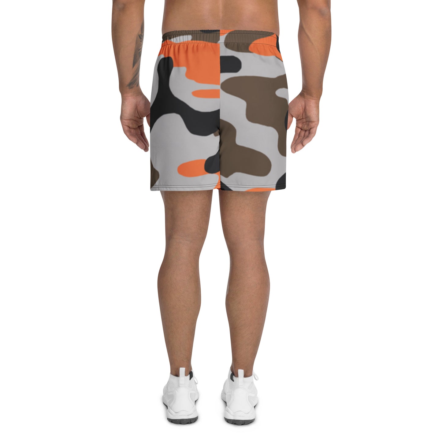 Camouflage-patterned shorts worn by a person on a white background
