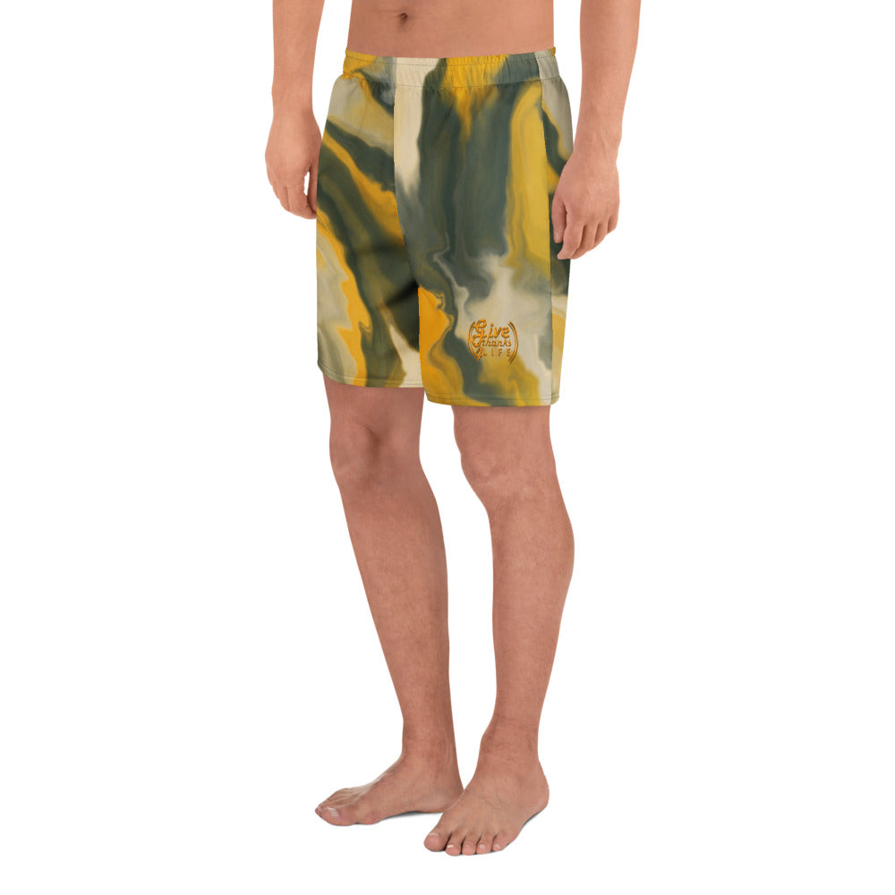 Person wearing camouflage shorts on a white background