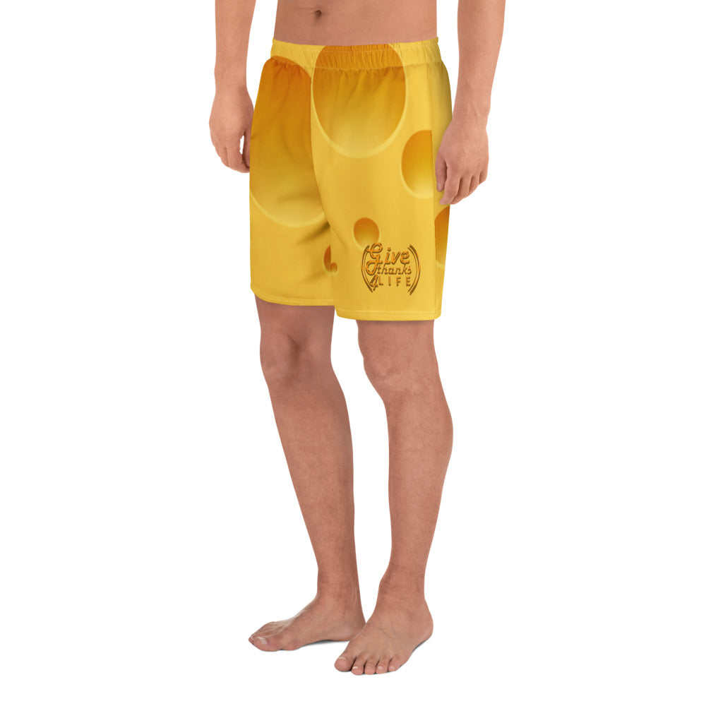 Yellow swim shorts with a logo on a white background