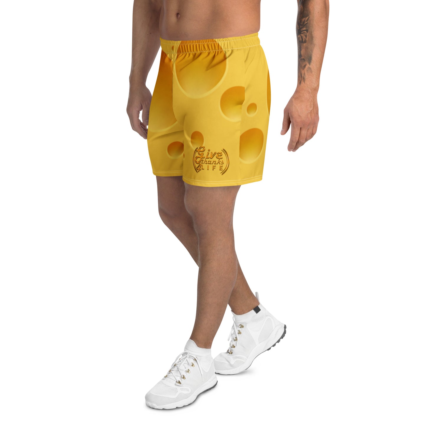 Yellow shorts with a unique design worn by a person on a white background