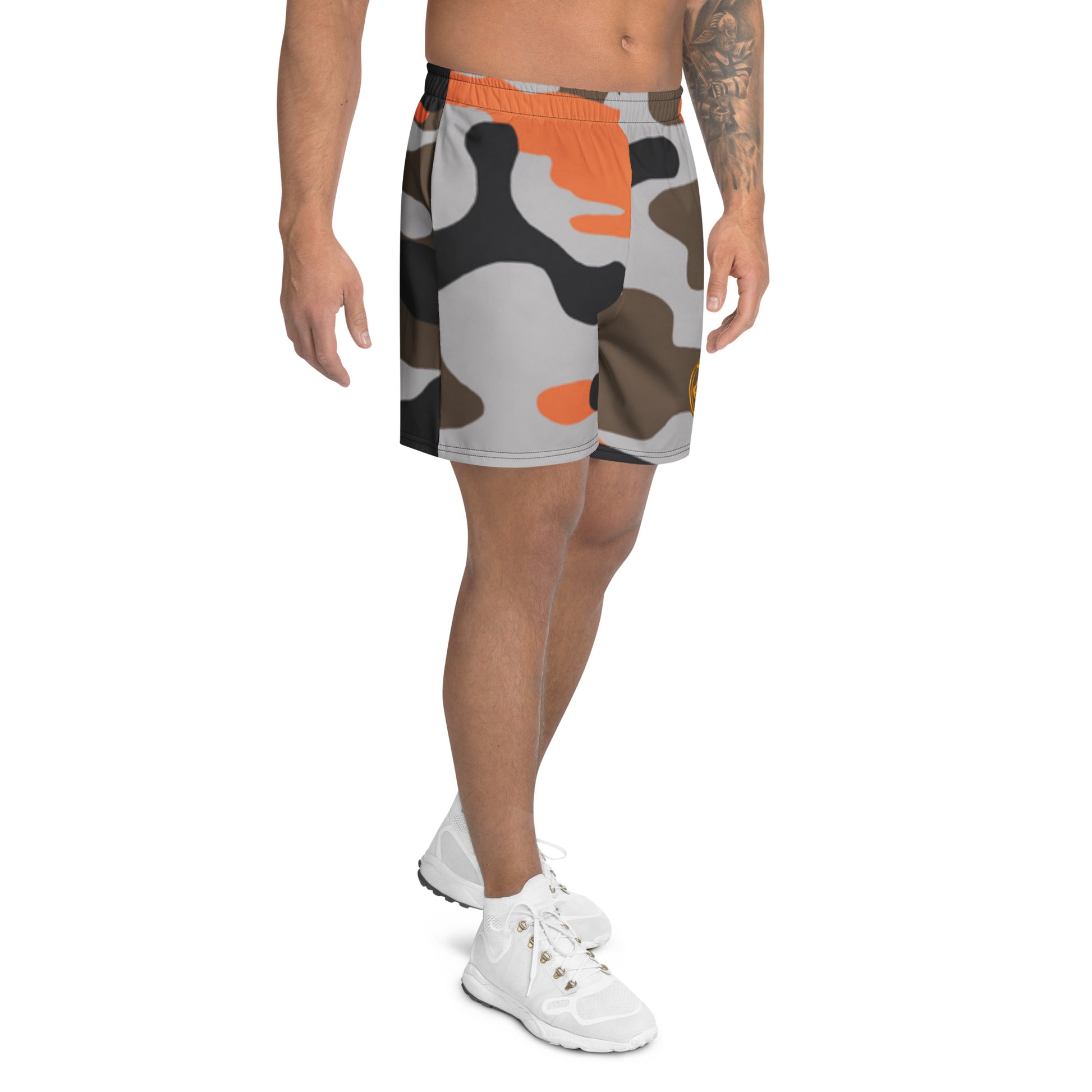 Person wearing camouflage shorts on a white background