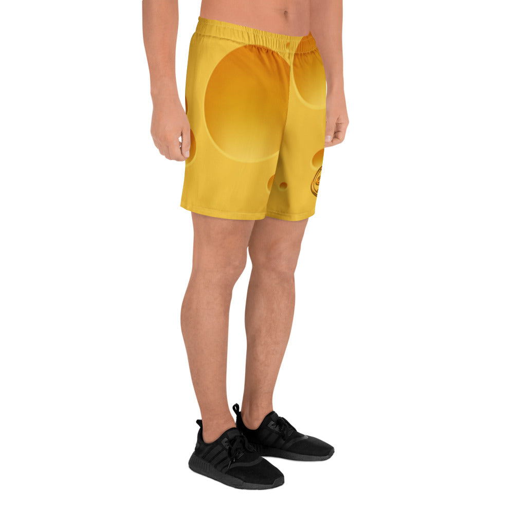 Person wearing bright yellow shorts on a white background