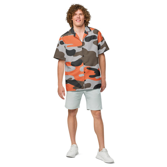 Person wearing a colorful camouflage shirt and white shorts on a white background