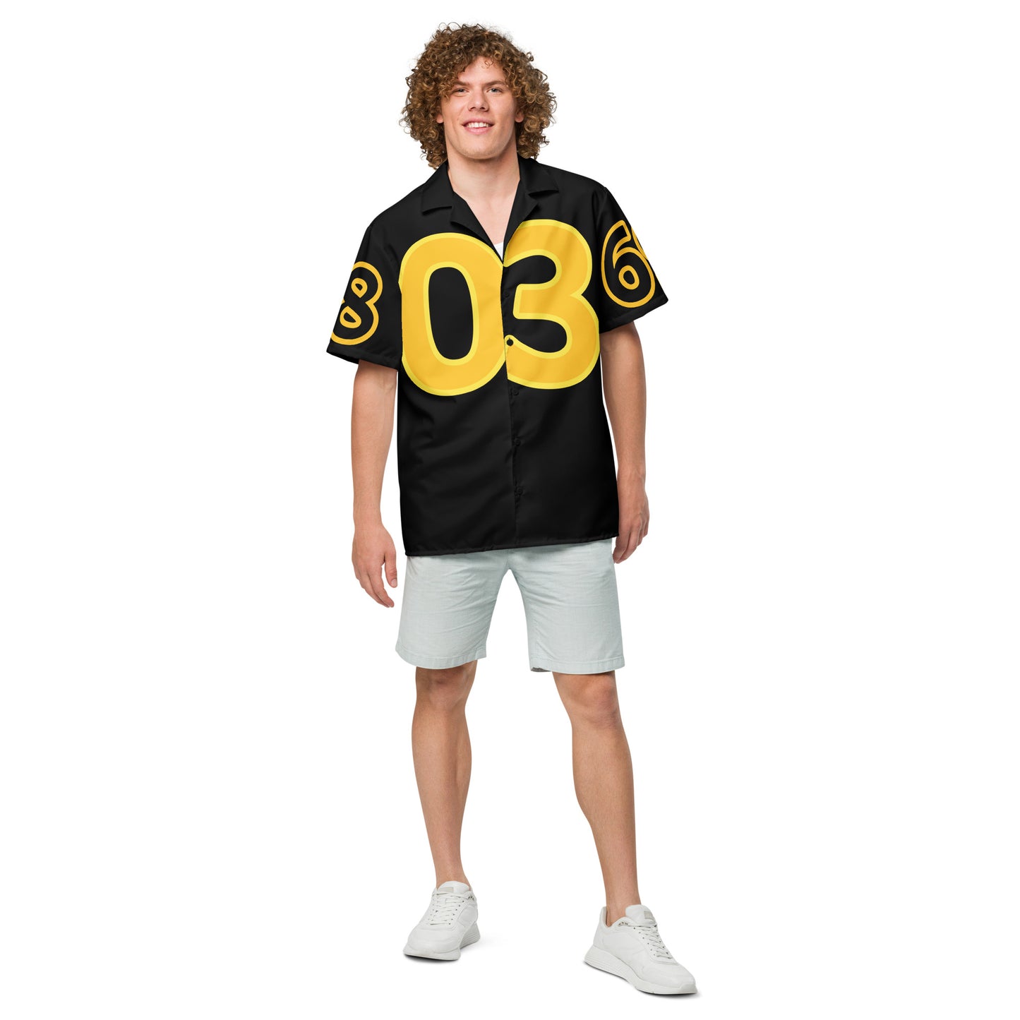 Person wearing a black jersey with yellow numbers on a white background