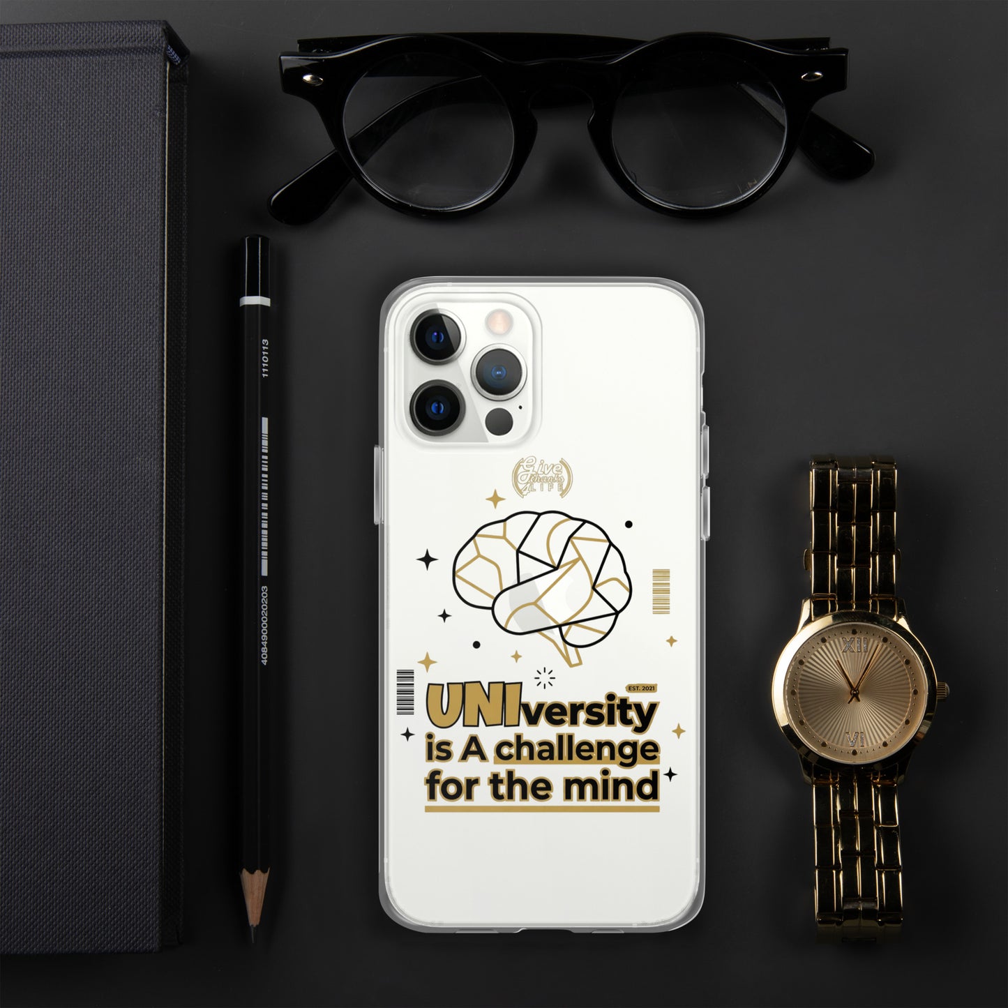 Phone case with brain design and text on a dark surface with glasses, pen, and watch.
