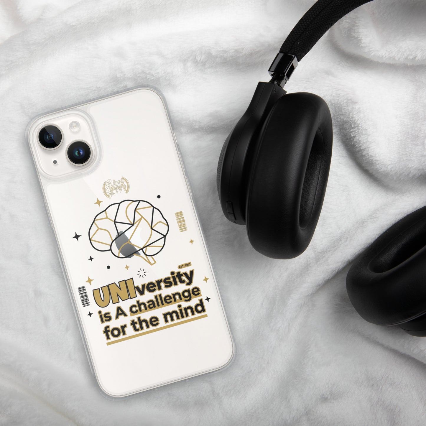 Phone case with a design and text on a marble surface with headphones