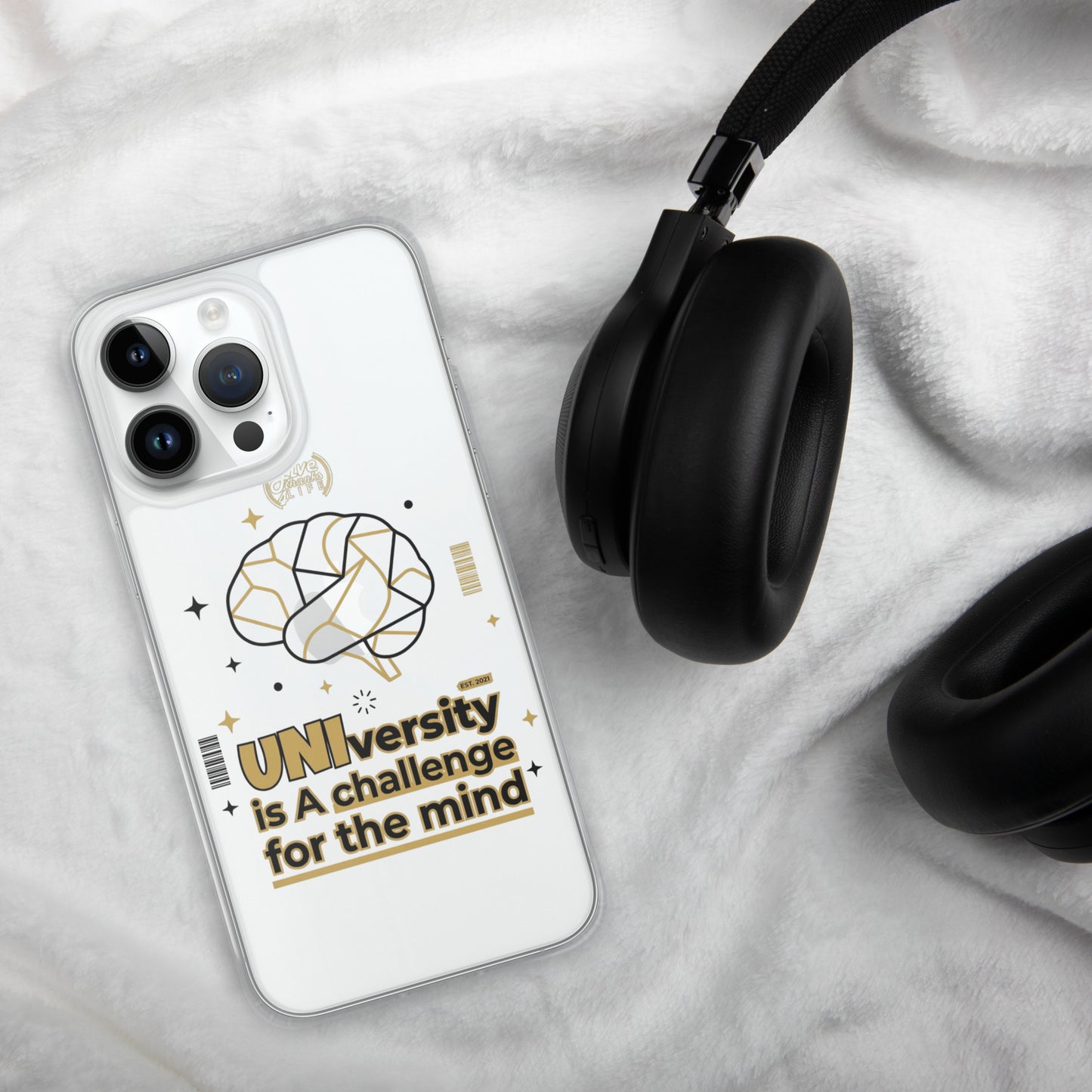 Phone case with brain design and text on a marble surface with headphones