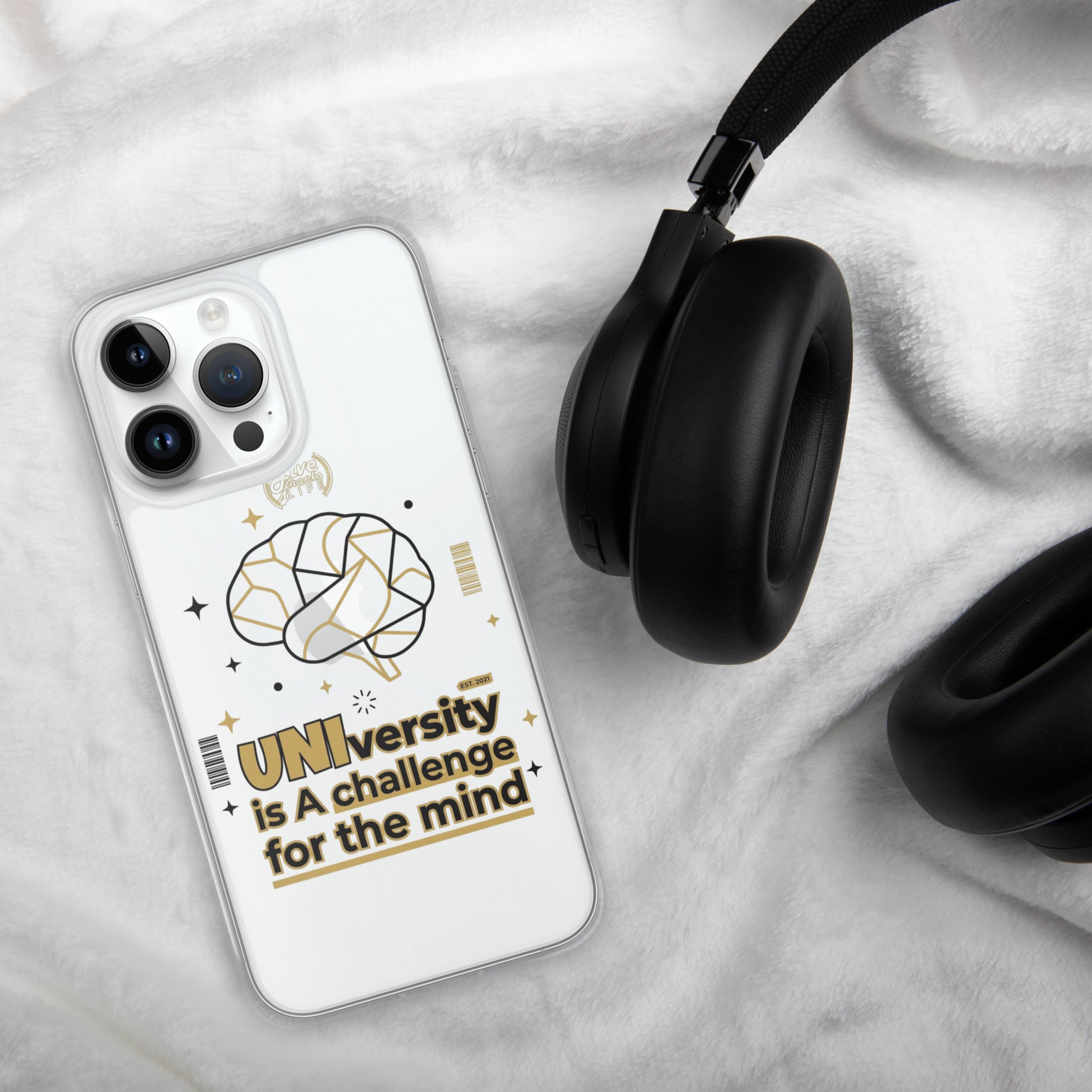 Phone case with brain design and text on a marble surface with headphones