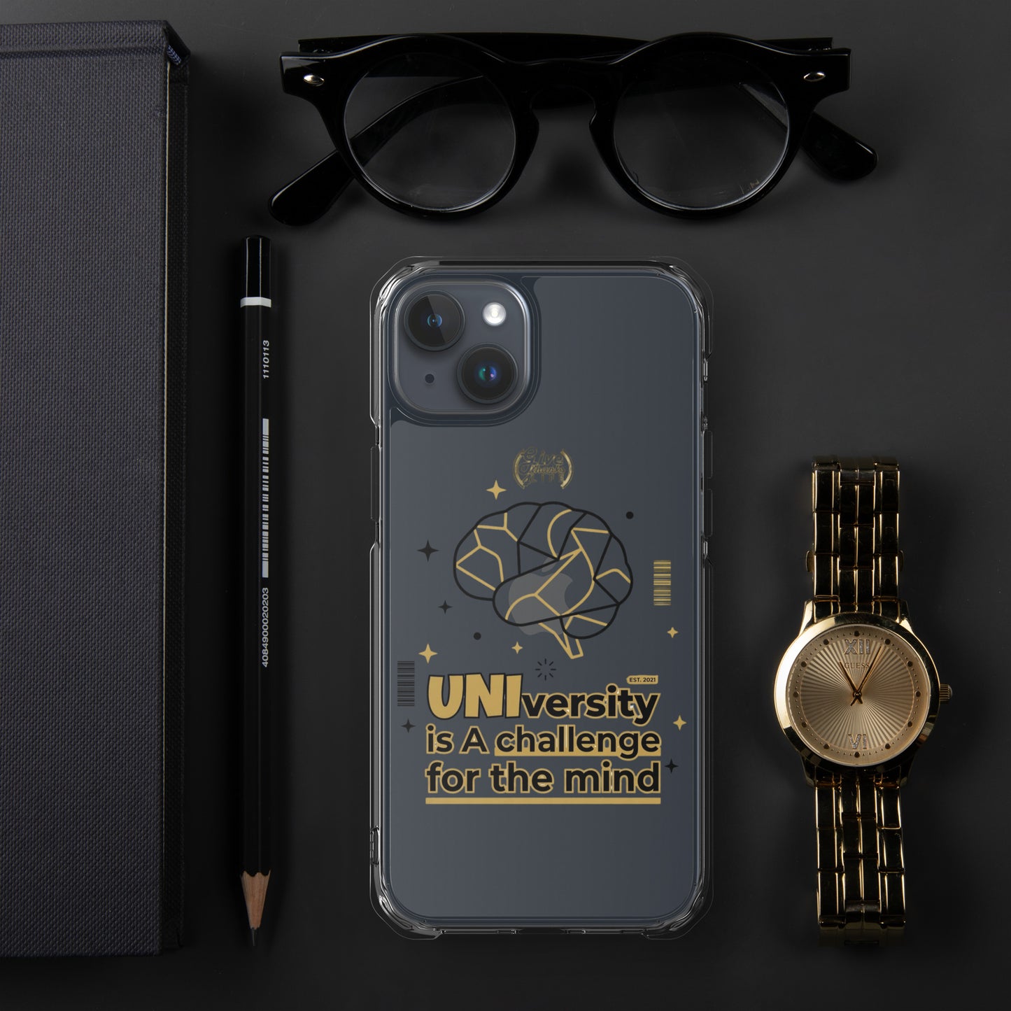 Phone case with brain design and text on a dark surface with glasses, pen, and watch.