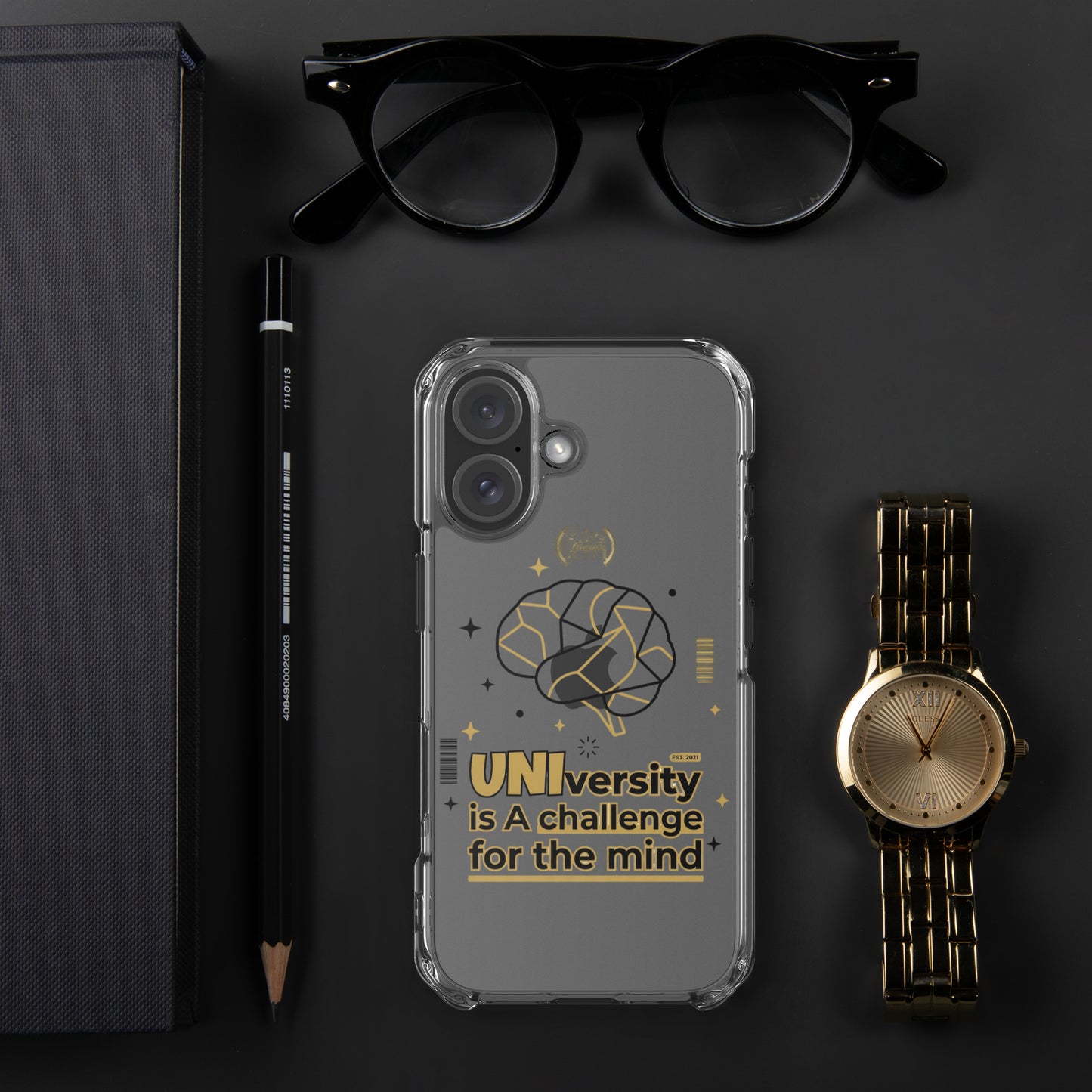 Phone case with text and design, placed on a dark surface with glasses, pen, and watch.