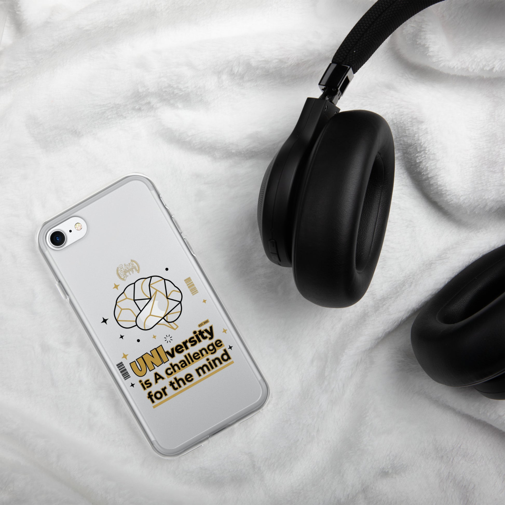 Phone case with text and design on a white surface with headphones