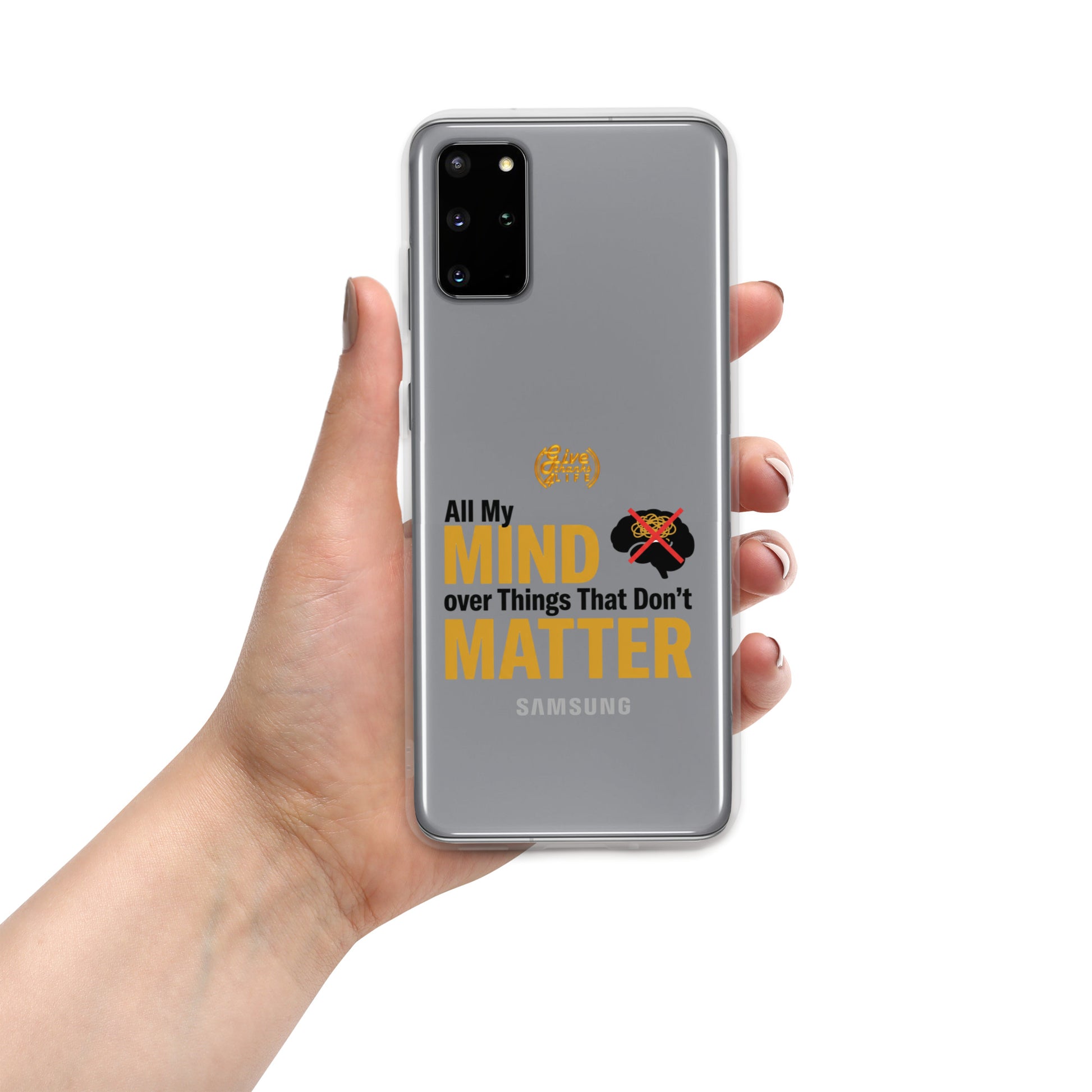 Phone case with 'Baby Monster' branding held by a hand on a white background