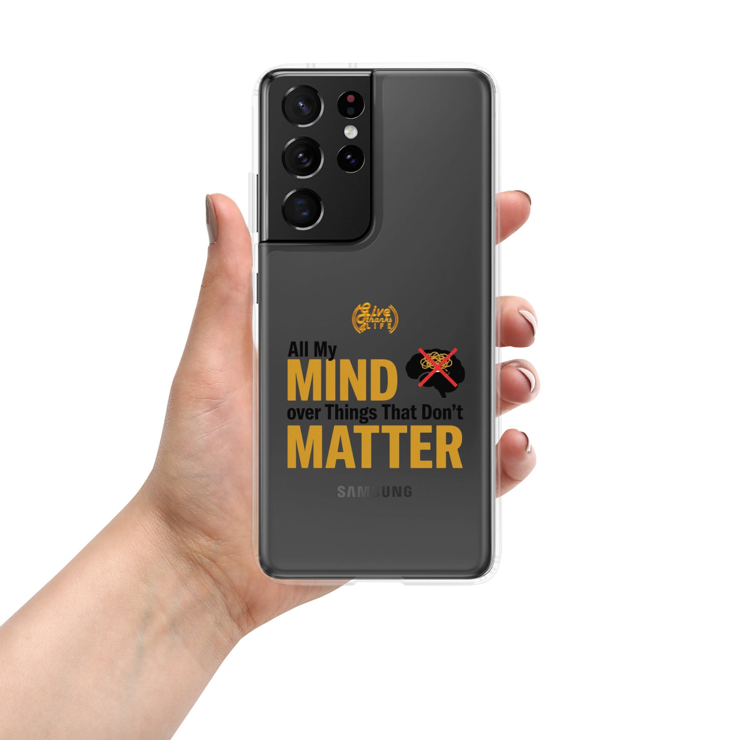 Hand holding a Samsung phone with a motivational quote on the case
