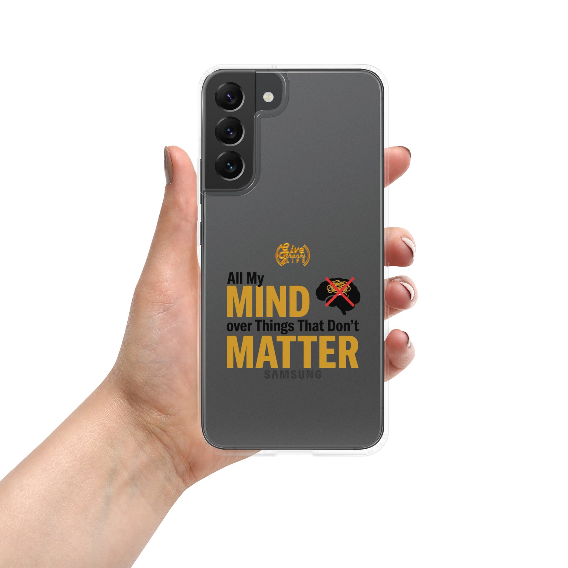Phone case with text 'All My Mind over Things That Don't Matter' held by a hand on a white background