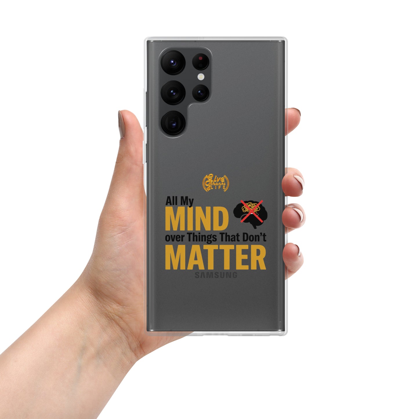 Hand holding a Samsung phone with a motivational quote on the case