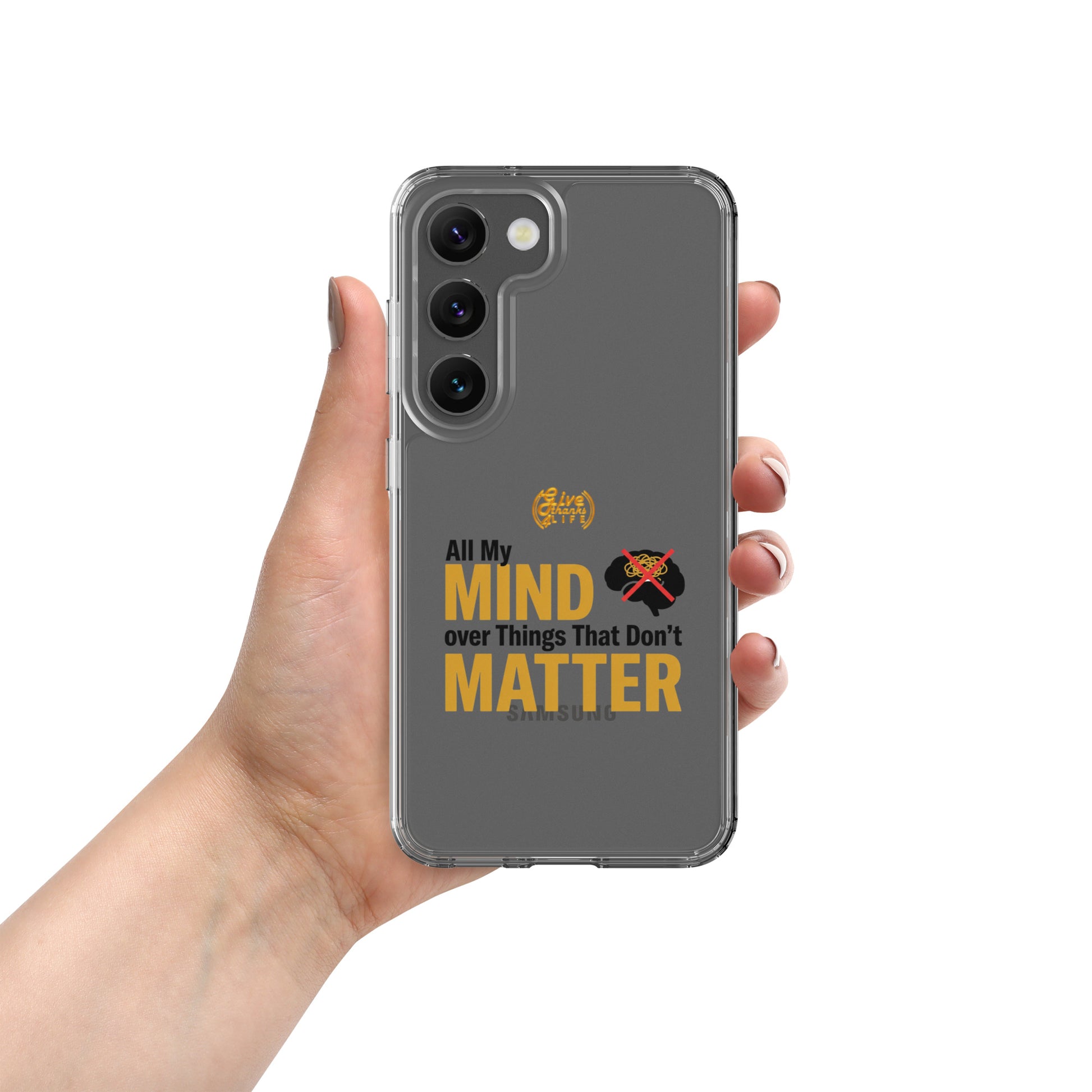 Phone case with text 'All My Mind over Things That Don't Matter' held by a hand on a white background