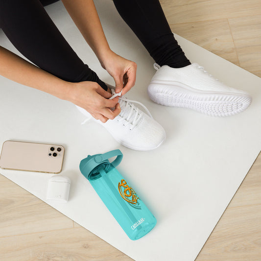 Person tying shoelaces with a turquoise water bottle and phone on a white mat.
