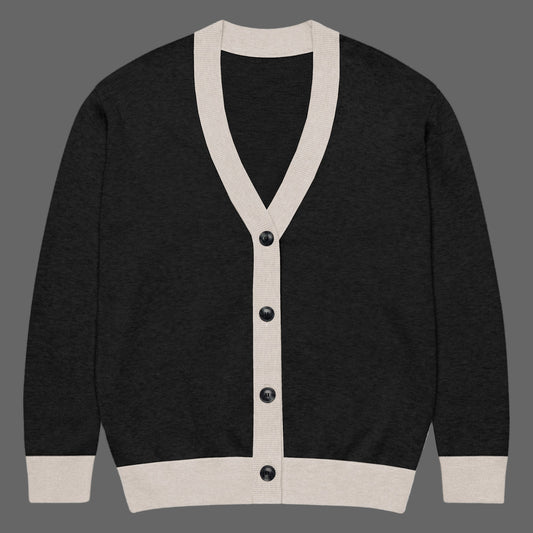 Black cardigan with beige trim and buttons on a white background