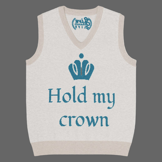 Beige sweater vest with blue text 'Hold my crown' and a crown graphic on a white background