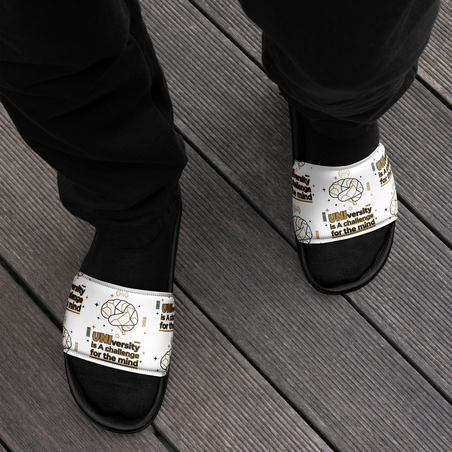 Black and white sandals with 'Scentopuck' branding on a wooden floor.