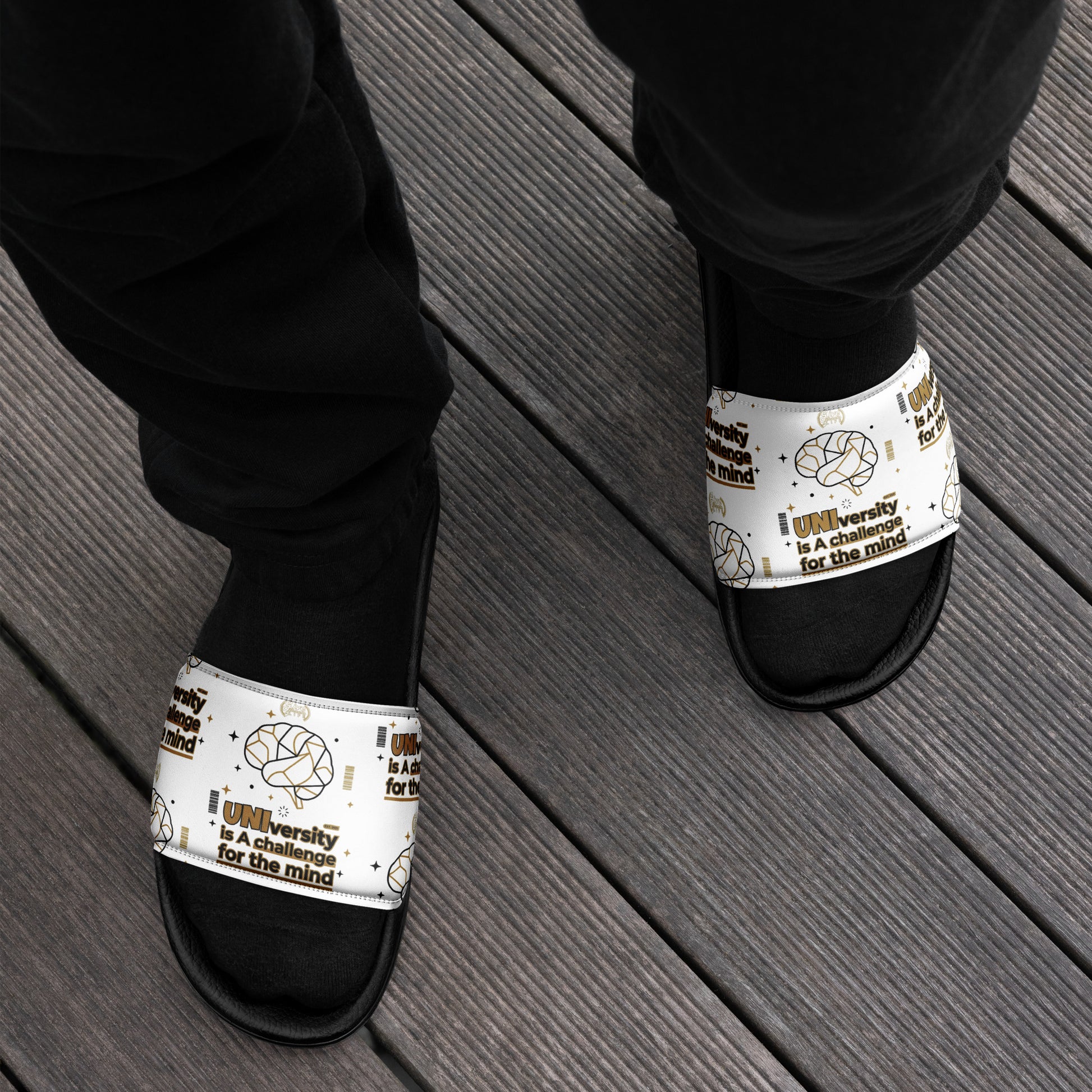 Black and white sandals with 'Scentopuck' branding on a wooden floor.