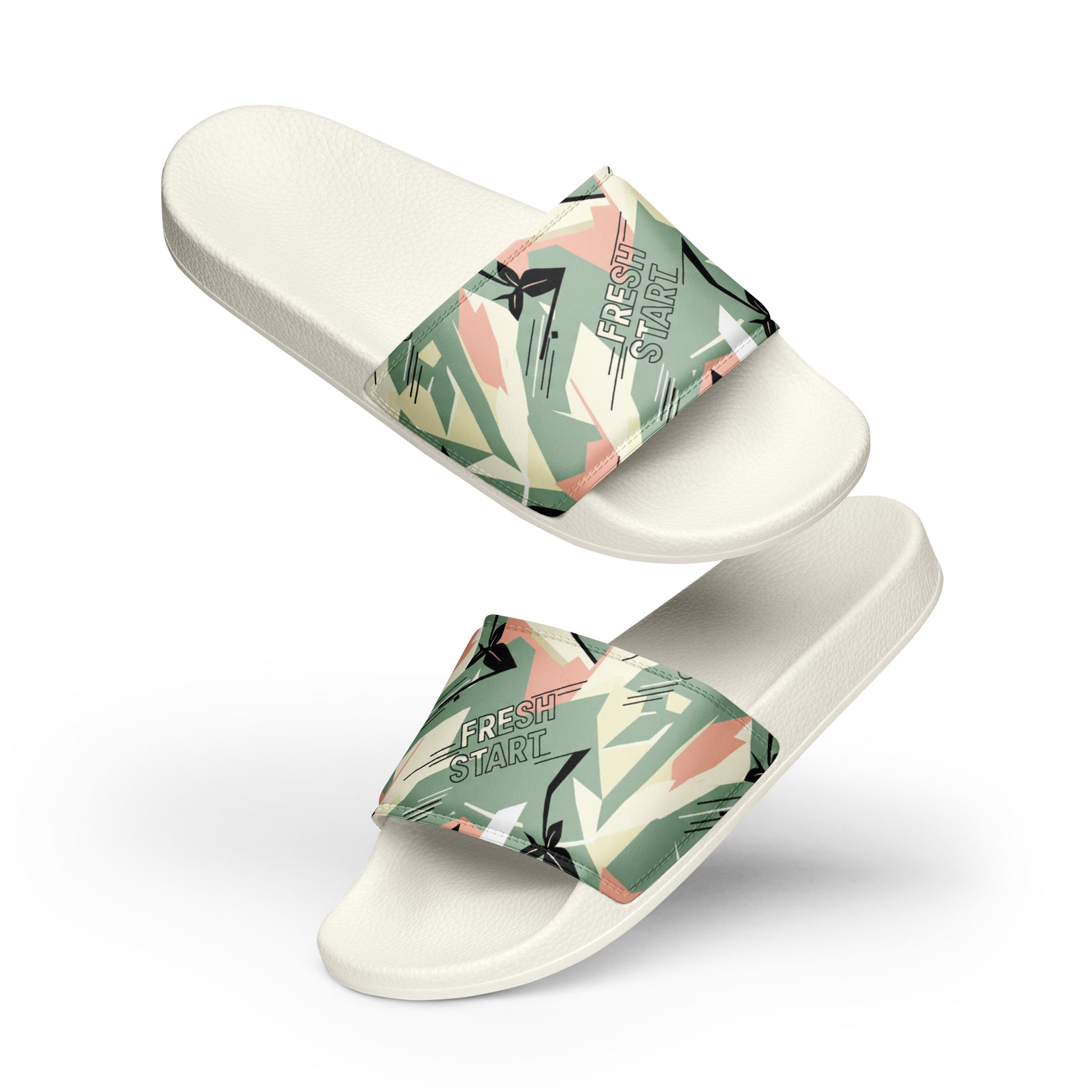 White slides with tropical leaf patterned straps on a white background