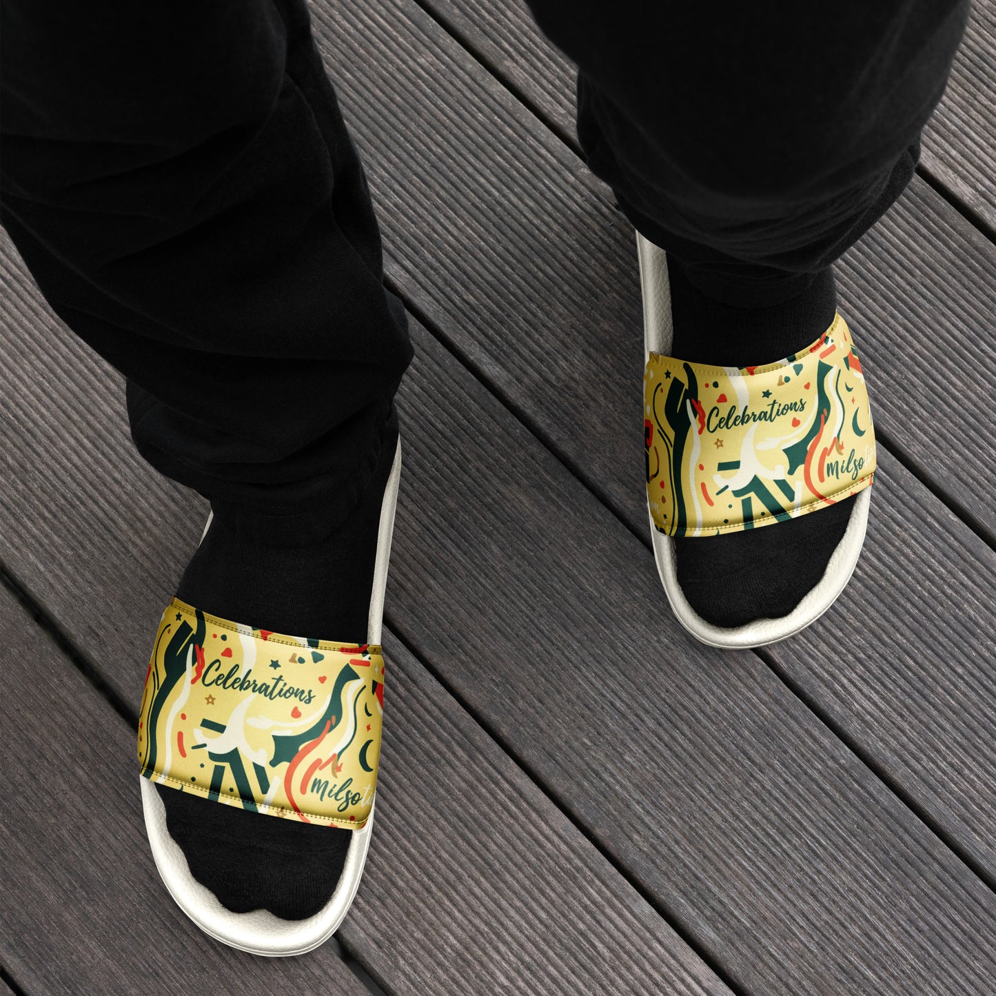 Colorful slippers with animal designs on a wooden floor