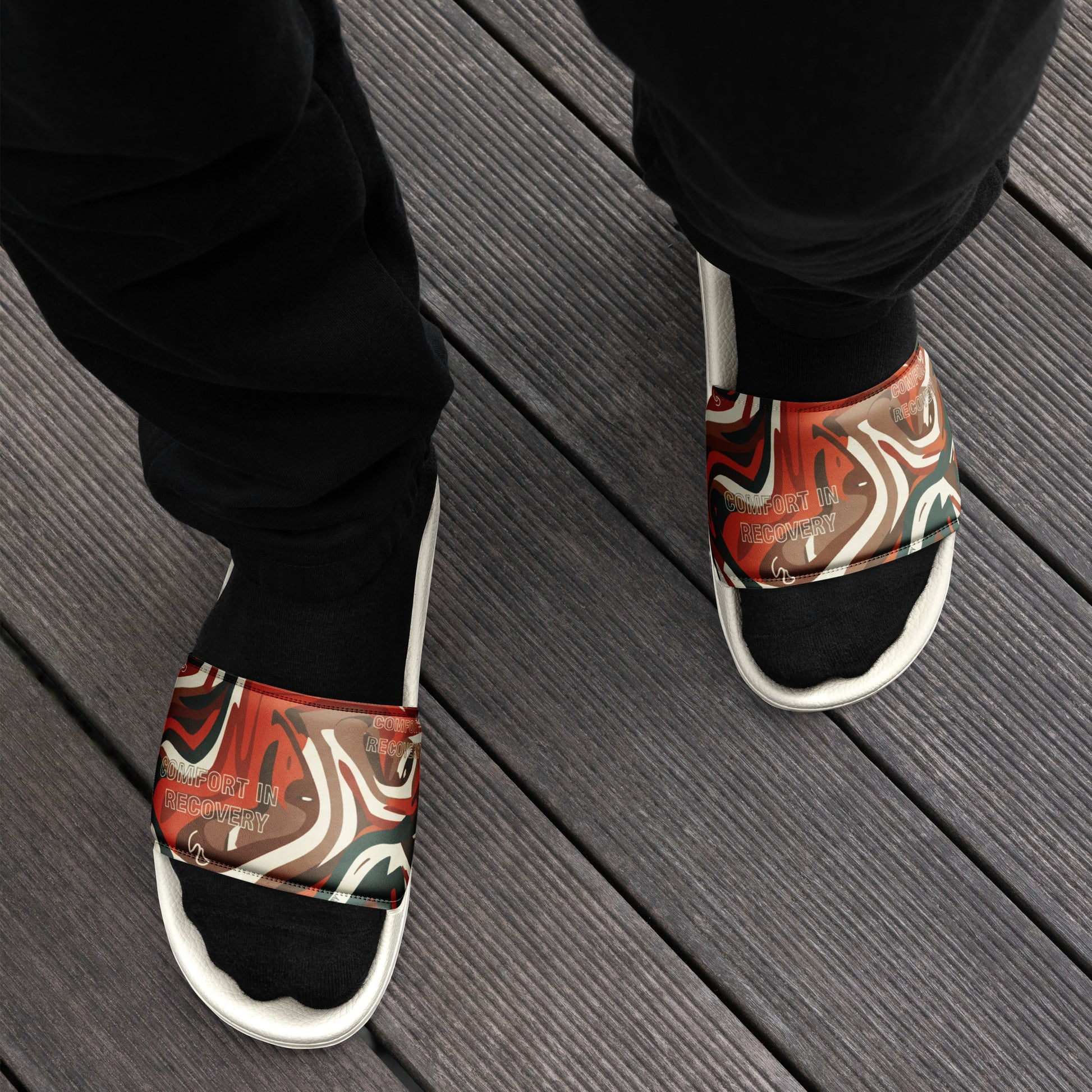 Person wearing colorful sandals on a wooden floor
