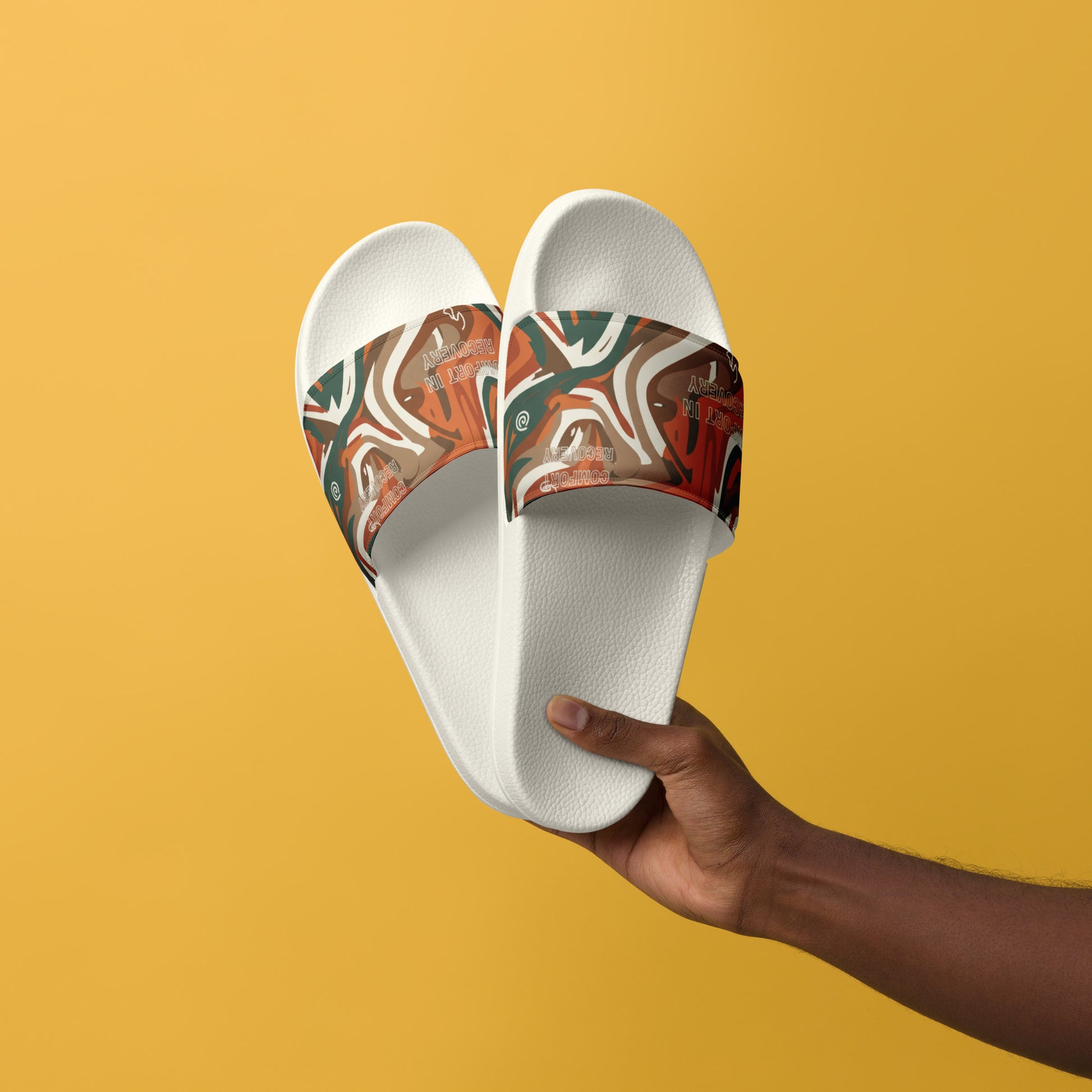 White slides with abstract pattern held by a hand against a yellow background