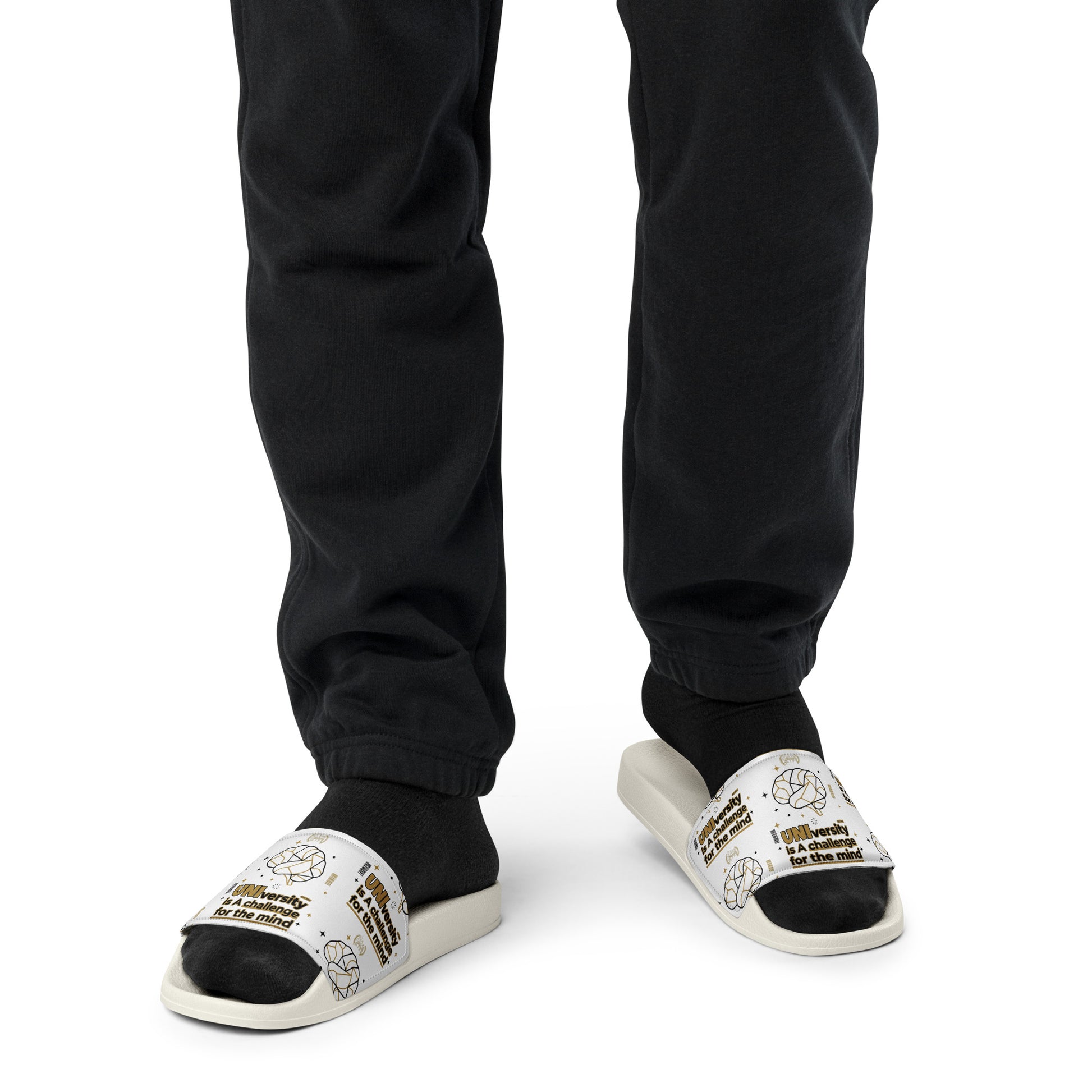 Person wearing black slides with text on a white background