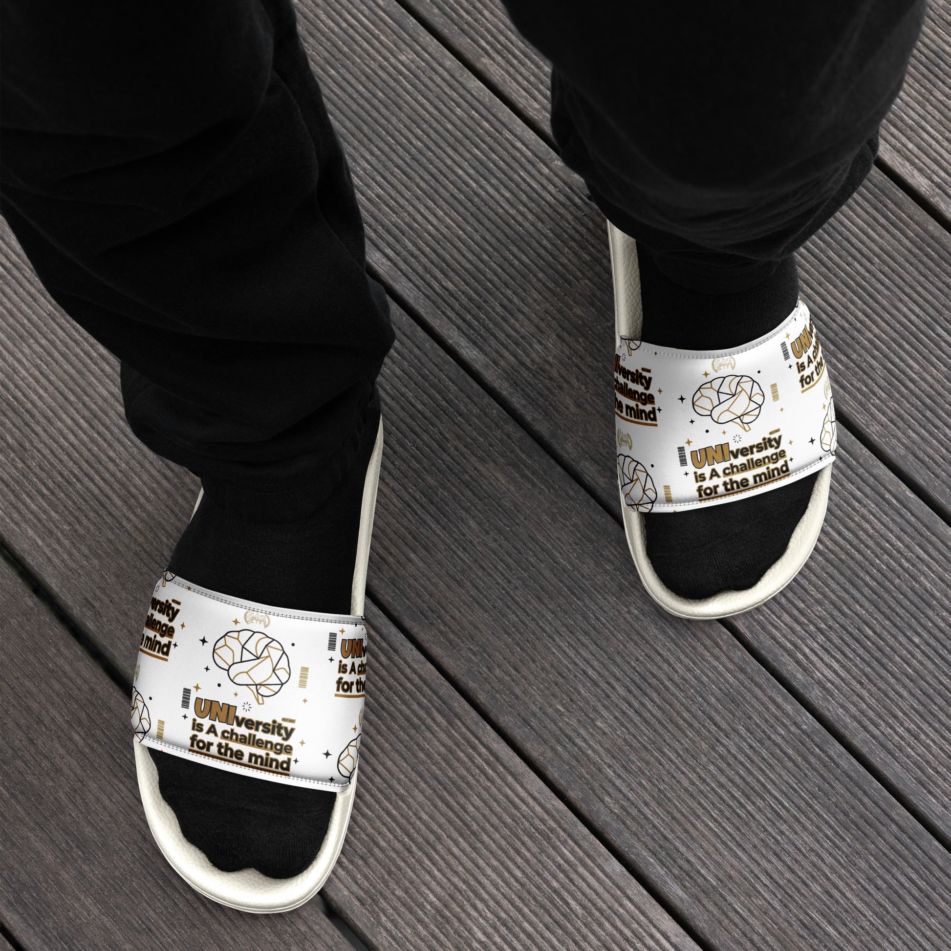 White sandals with text and graphics on a wooden floor