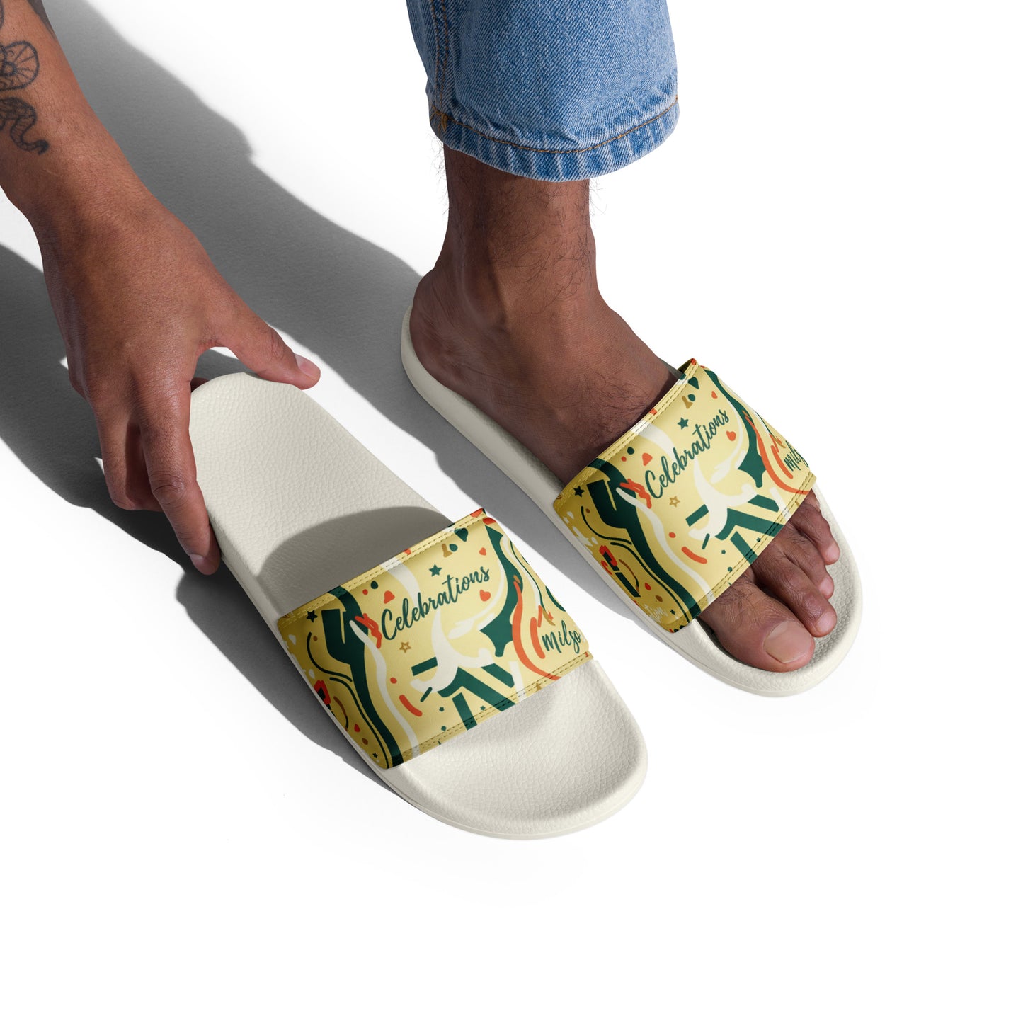 Person wearing colorful slides with a design on a white background