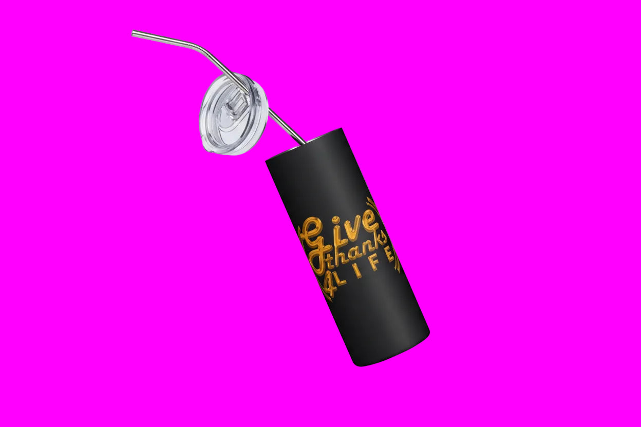 Black tumbler with gold text and a straw on a white background