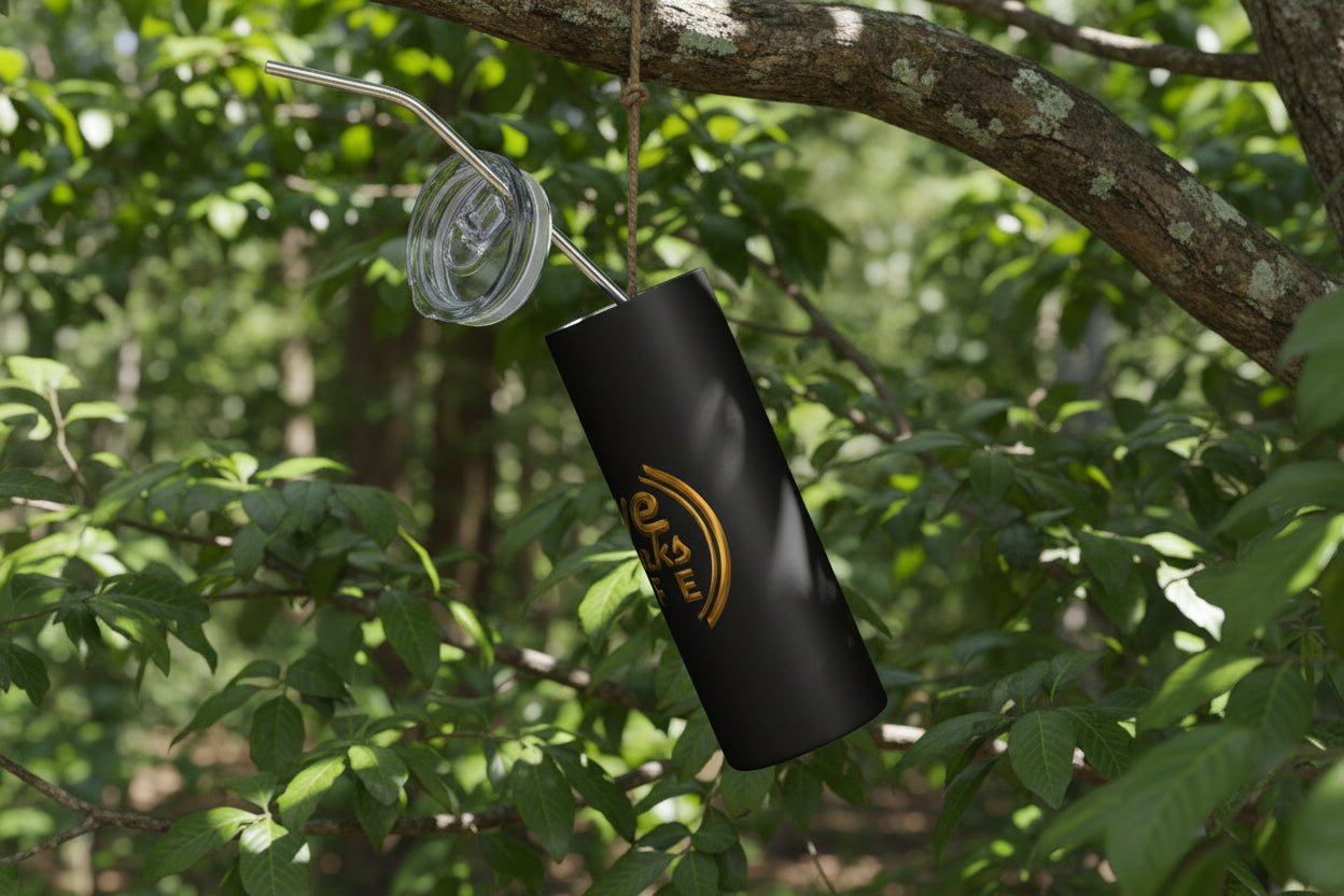 Black tumbler with a straw and clear lid on a white background