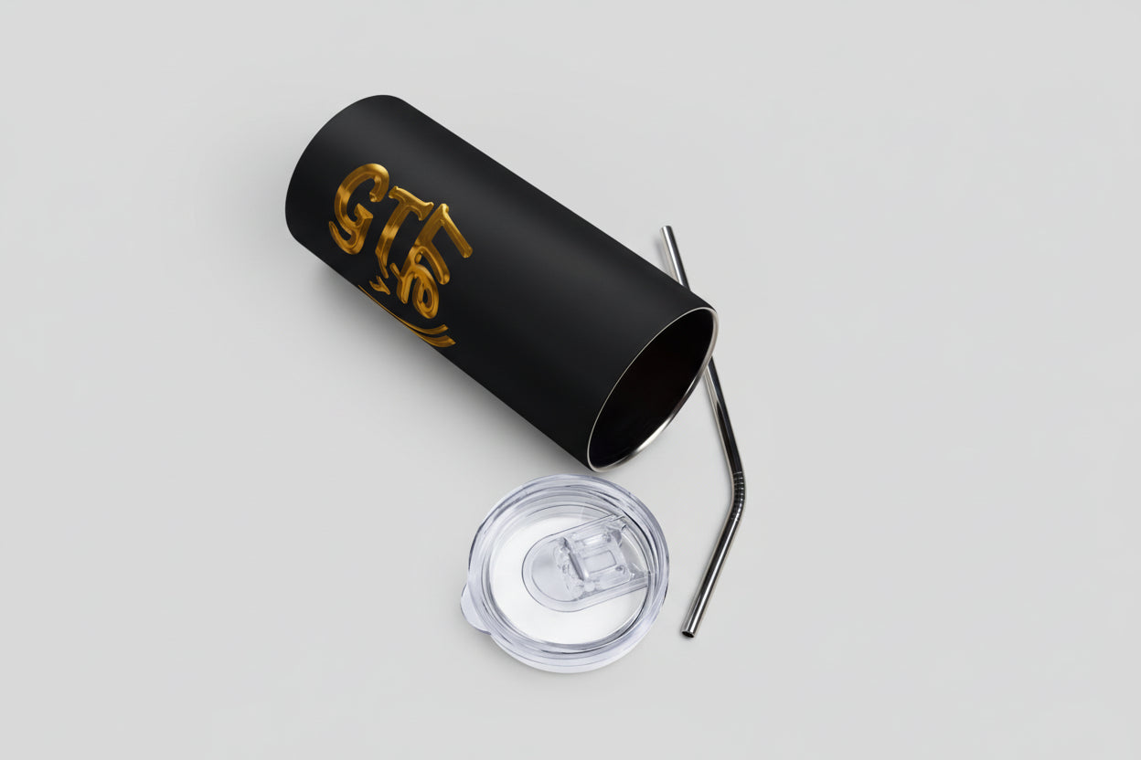 Black tumbler with clear lid and metal straw on a white background