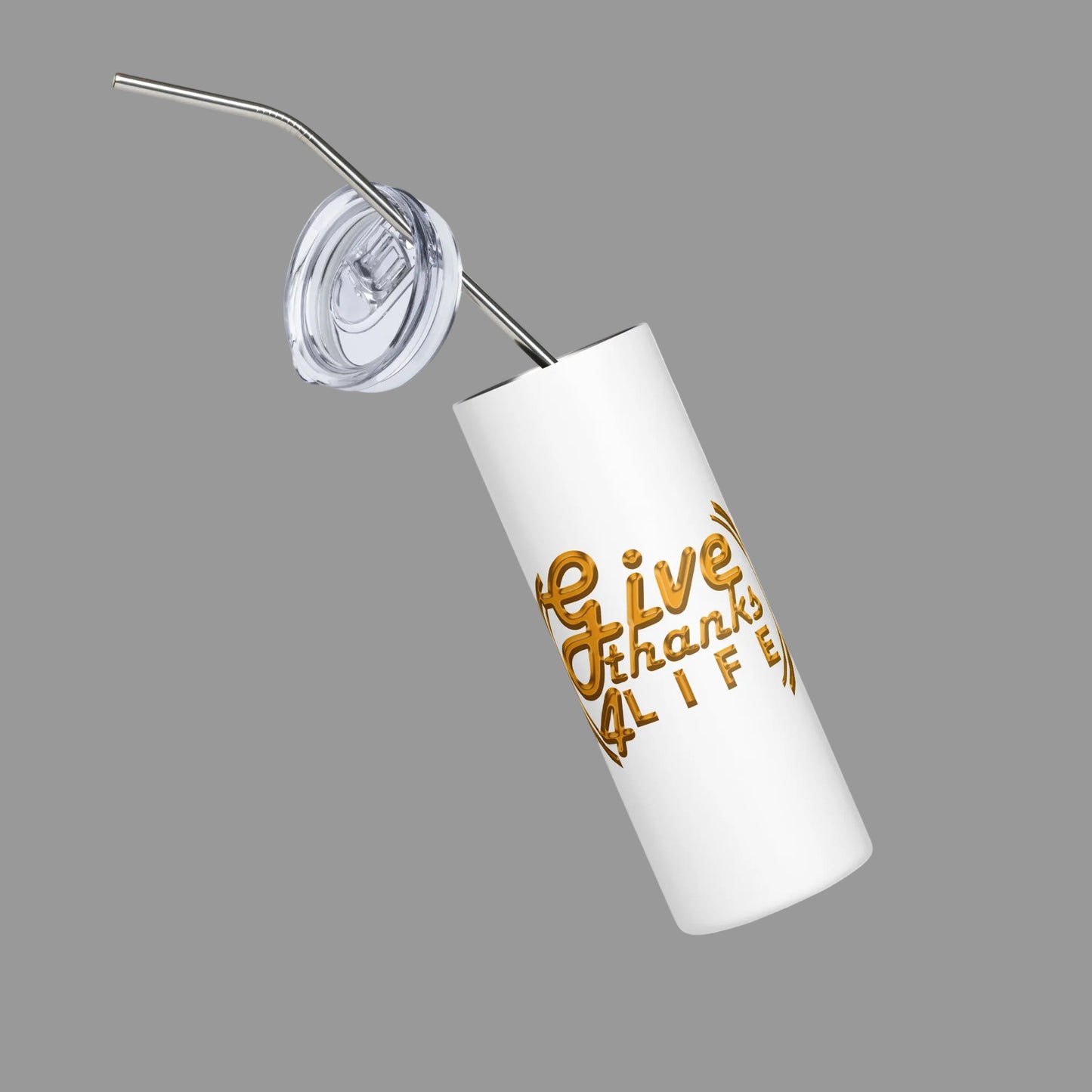White tumbler with gold text and a metal straw on a white background