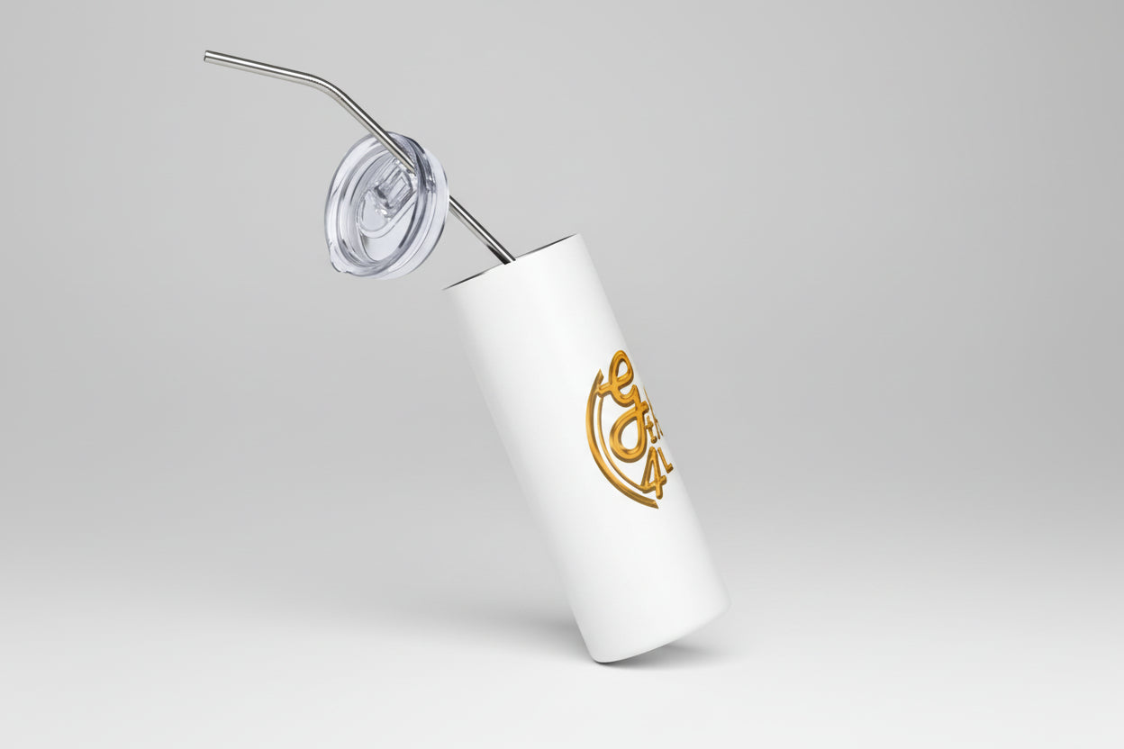 White tumbler with gold logo and straw on a white background