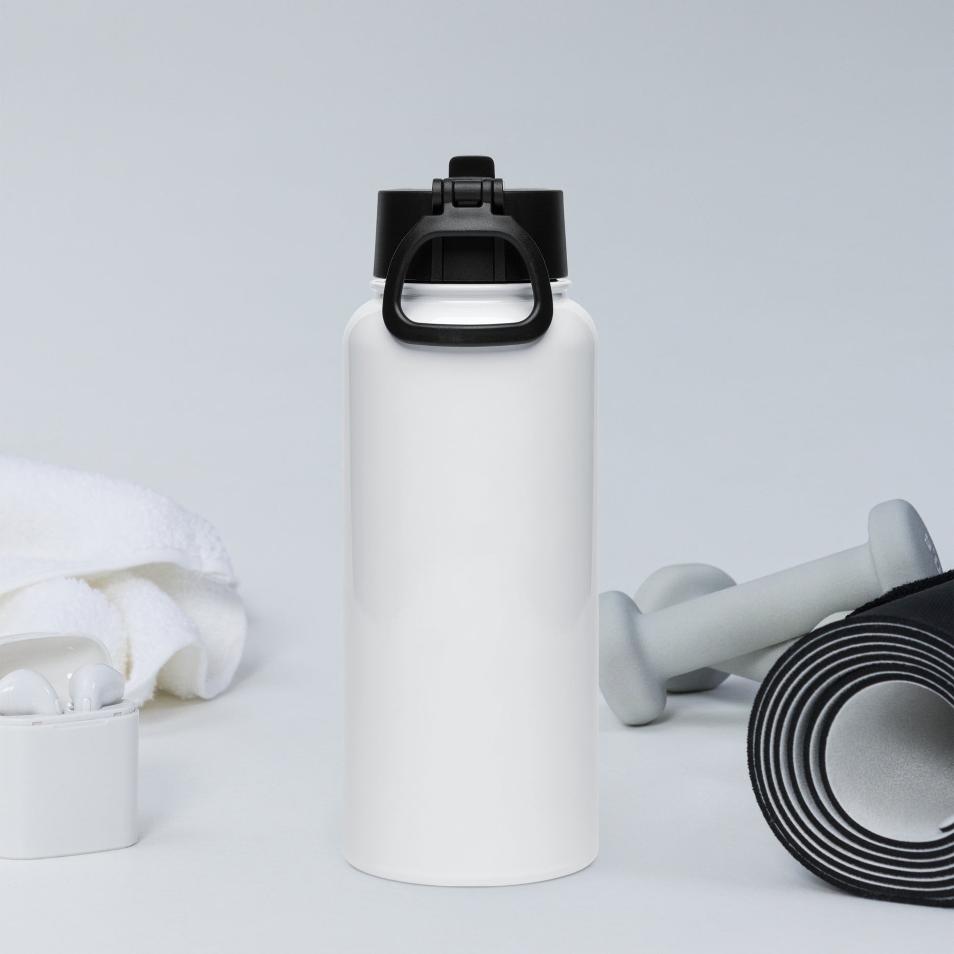 White water bottle with black cap, white earbuds, gray dumbbells, and black resistance band on a light gray background