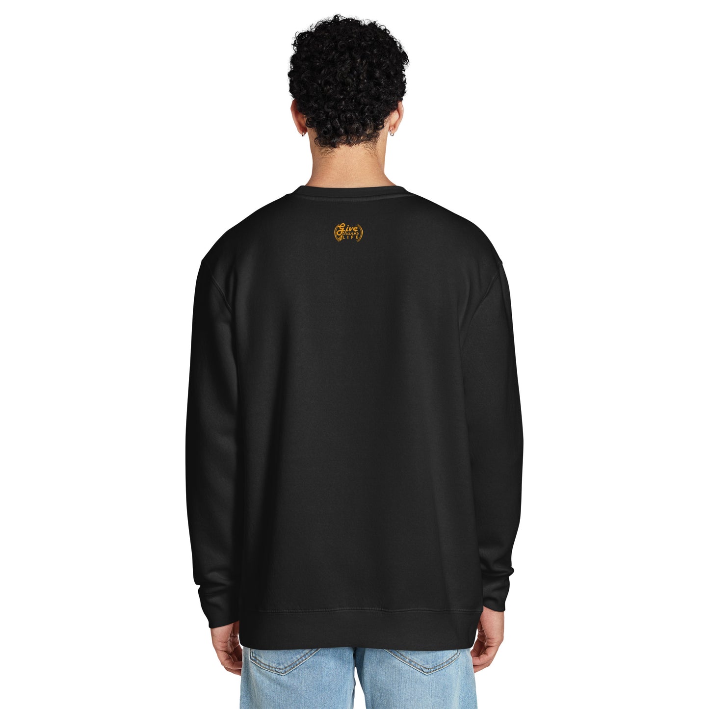 Person wearing a black sweatshirt with a logo on the back against a white background